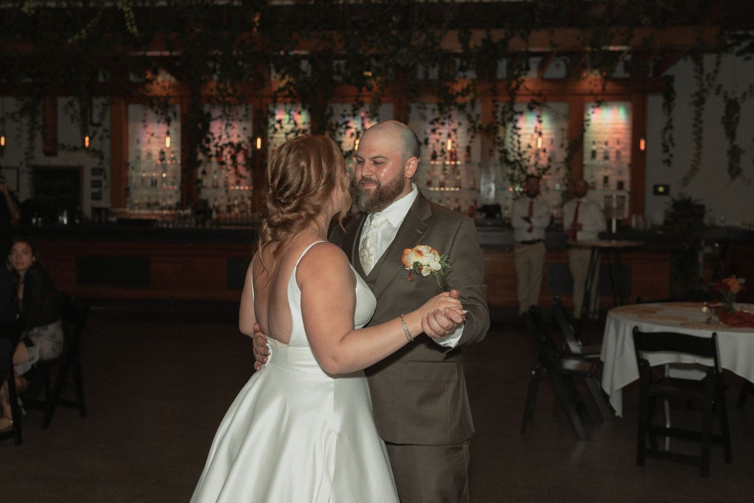 Wedding couples dancing at dimly lit reception venue with romantic ambiance at The Ivy House in Milwaukee Wisconsin