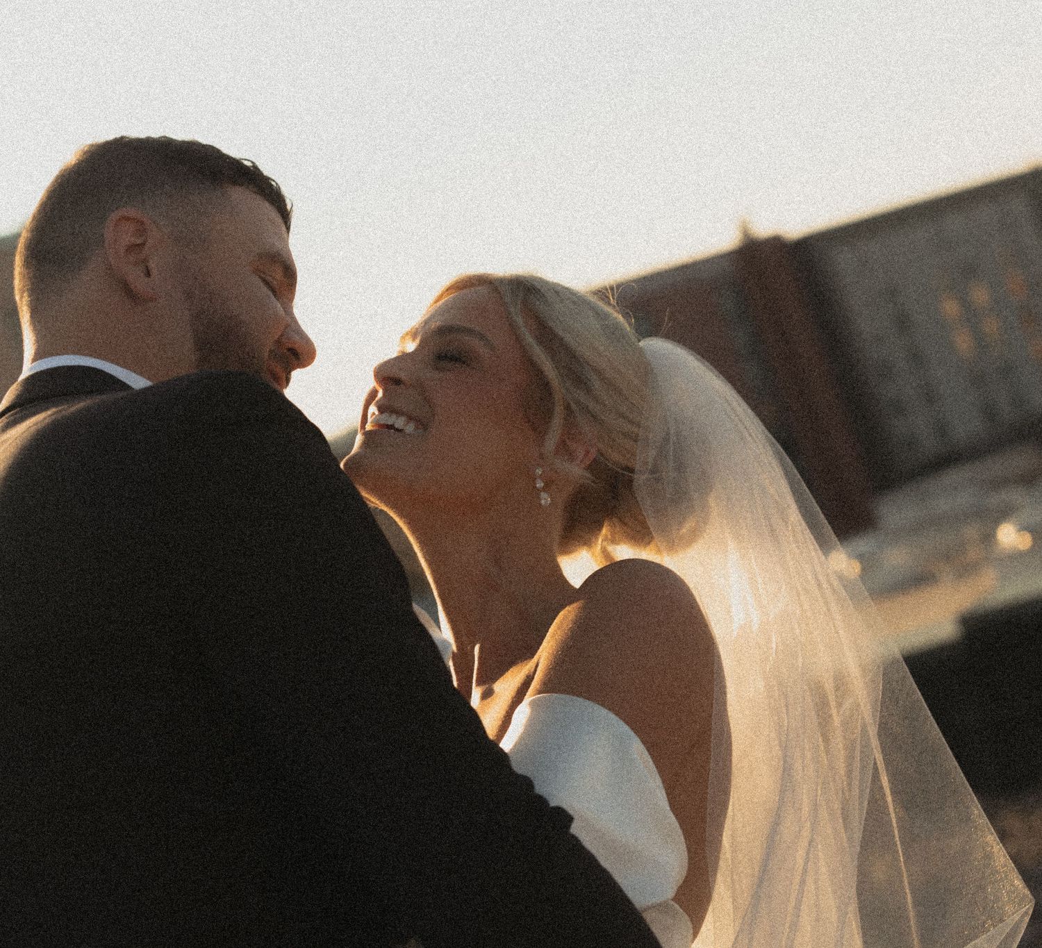 Silhouetted couple sharing an intimate sunset moment outdoors rooftopat Le Venere wedding venue in Saint Paul Minnesota