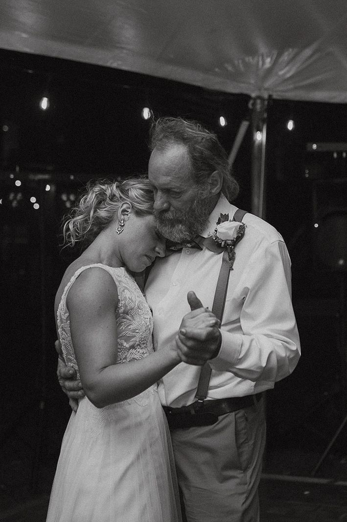 Black and white photo of emotional father-daughter dance at wedding reception at Bug-bee Resort Paynesville Minnesota