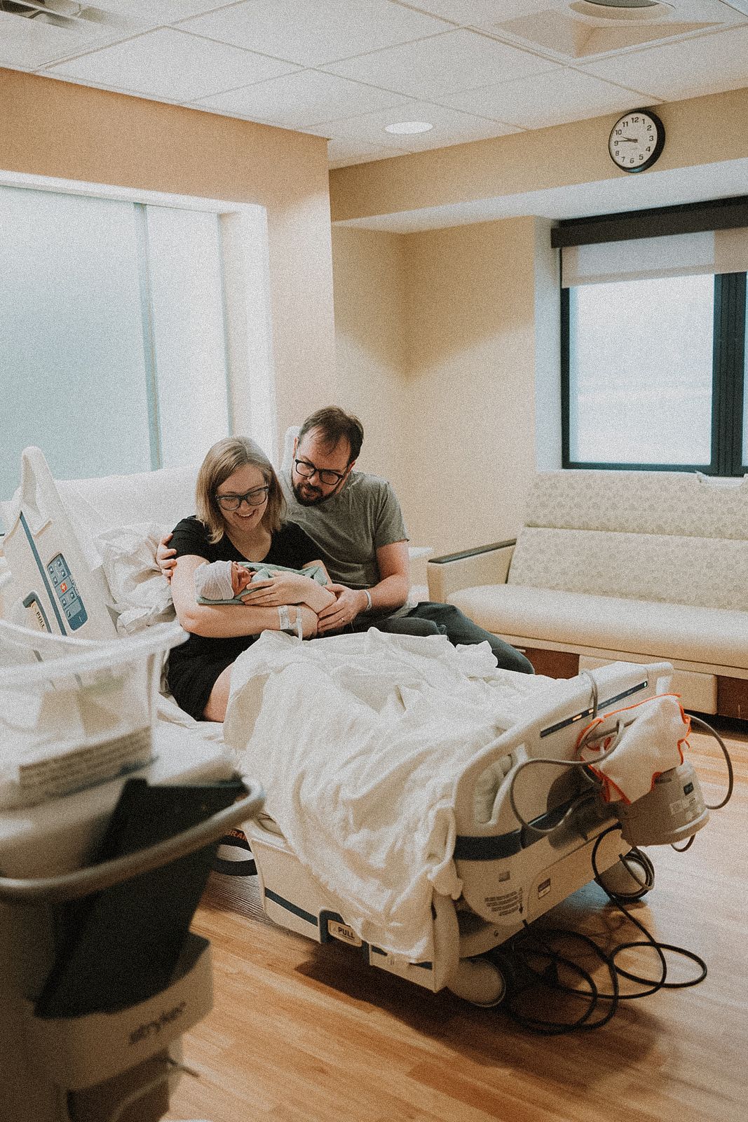 A series of photos showing a patient resting in a medical reclining chair. New mother and father first moment with their new born baby