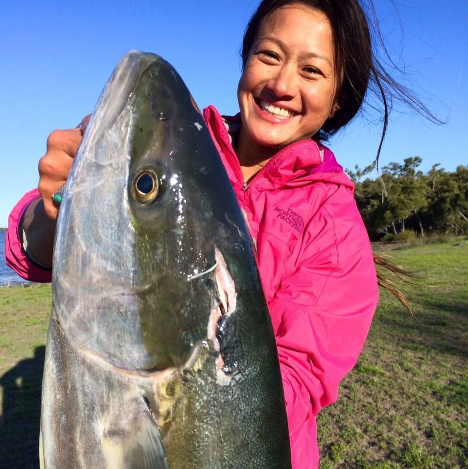Sequence of photos showing someone in pink jacket proudly displaying a large freshly caught fish in outdoor setting.