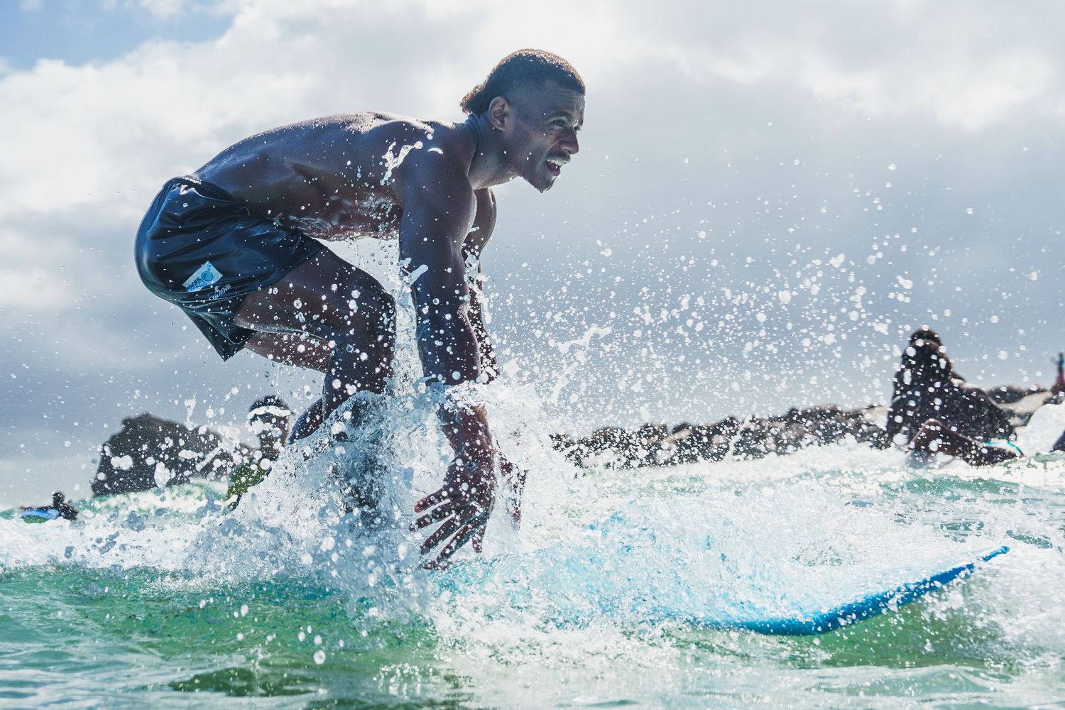 Action sequence of surfer riding waves with dramatic water splashes.