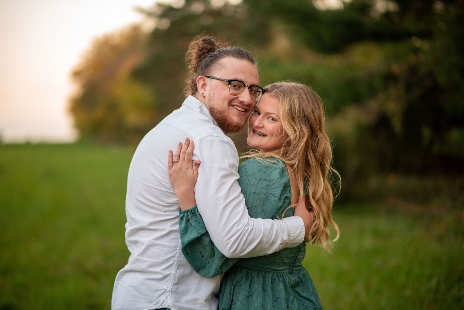 A joyful embrace captured during an outdoor engagement session.