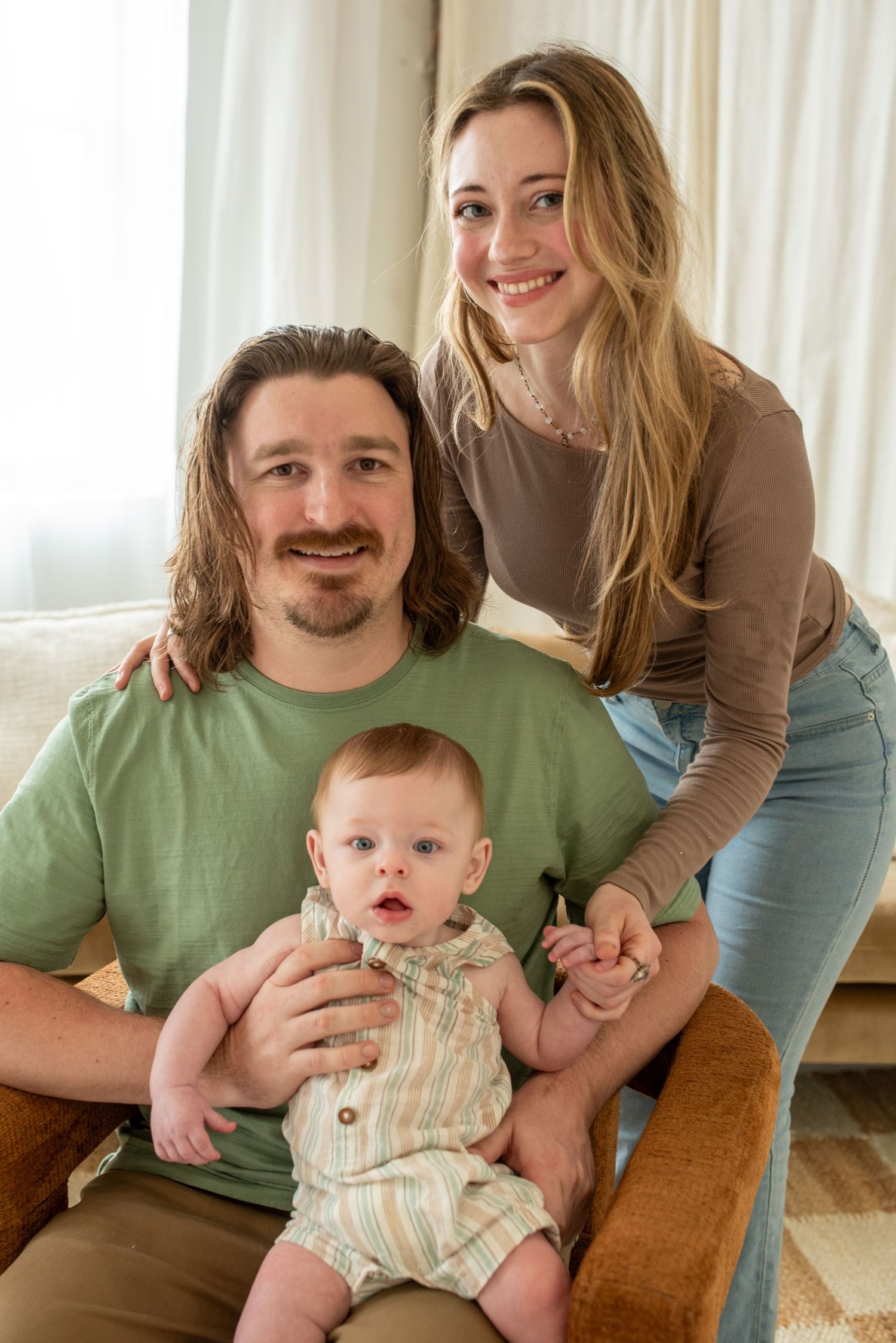 A sweet family moment captured in a bright indoor setting.