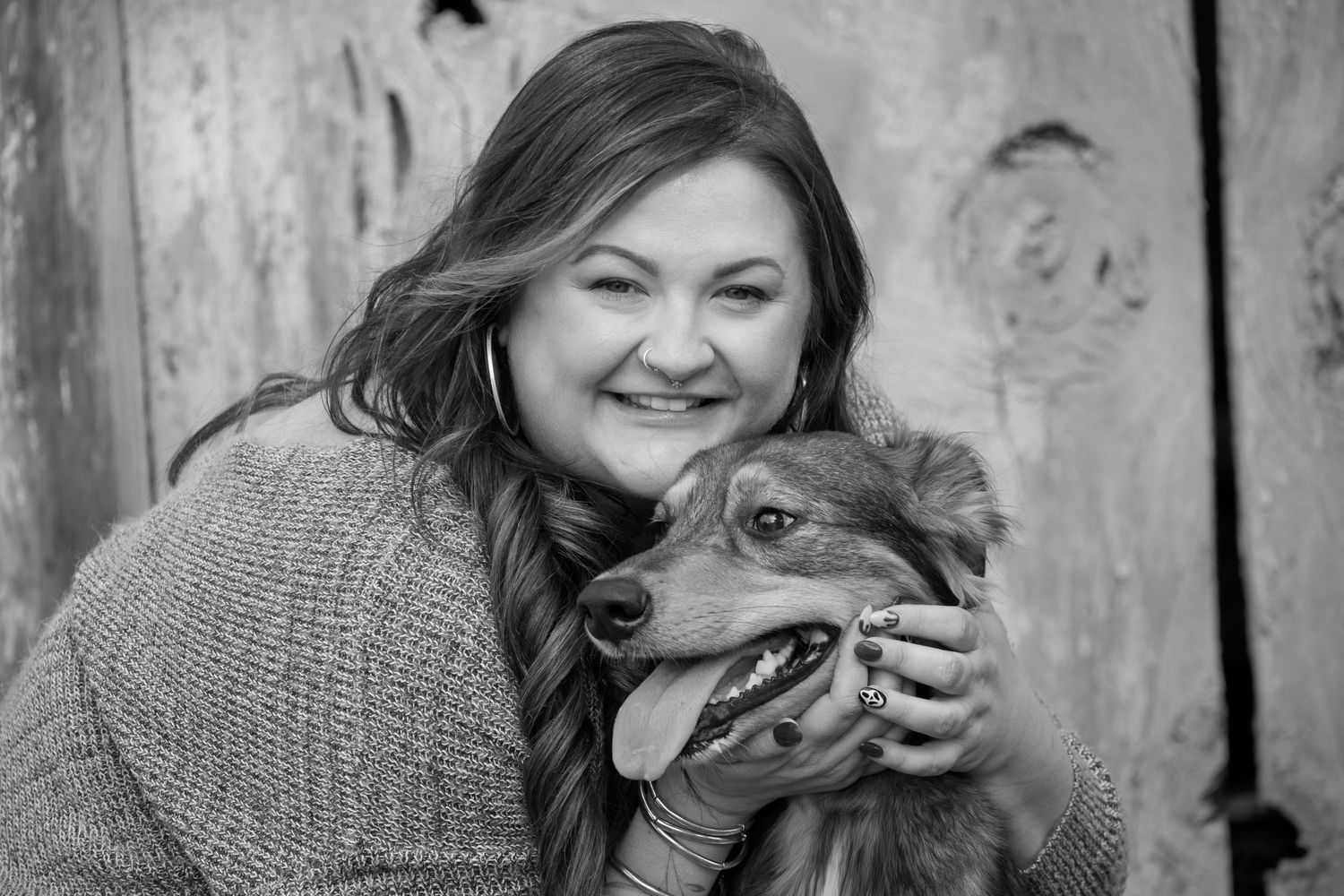 Candid moments with woman and dog against distressed blue wall.