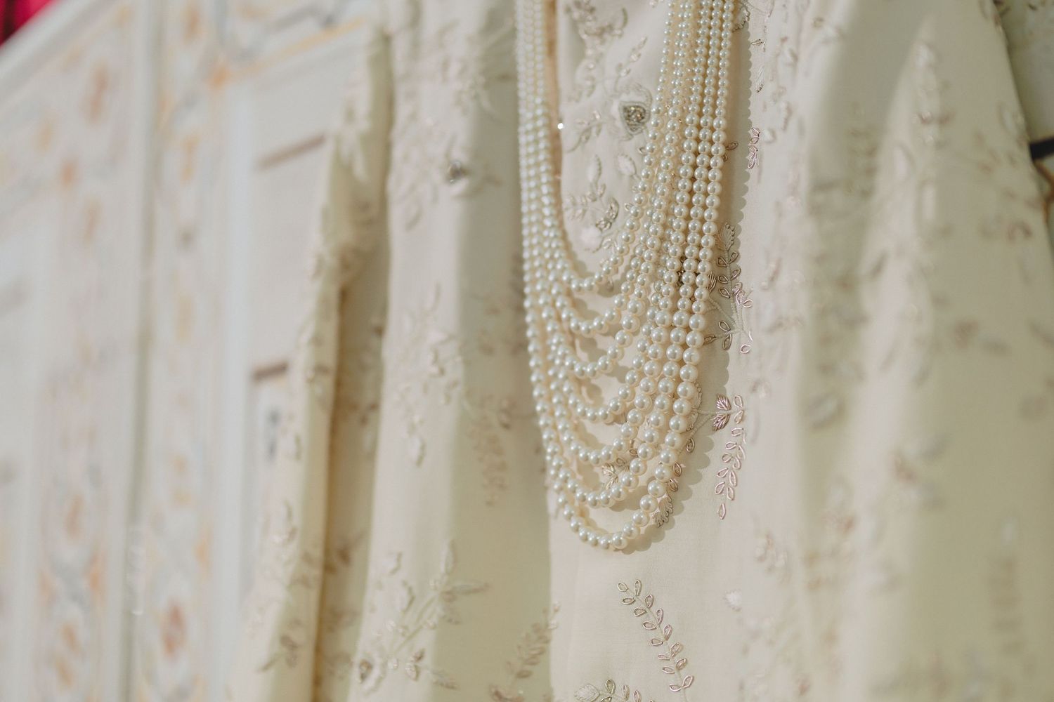 Elegant white dress with delicate pearl and beaded embellishments.