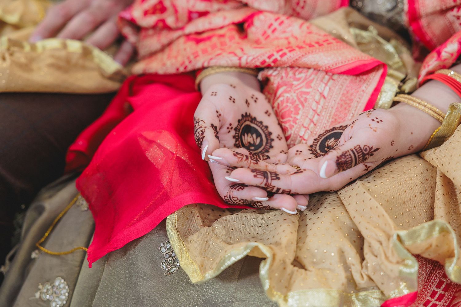 Detailed shot of pink and red fabric arrangements with intricate patterns and textures.