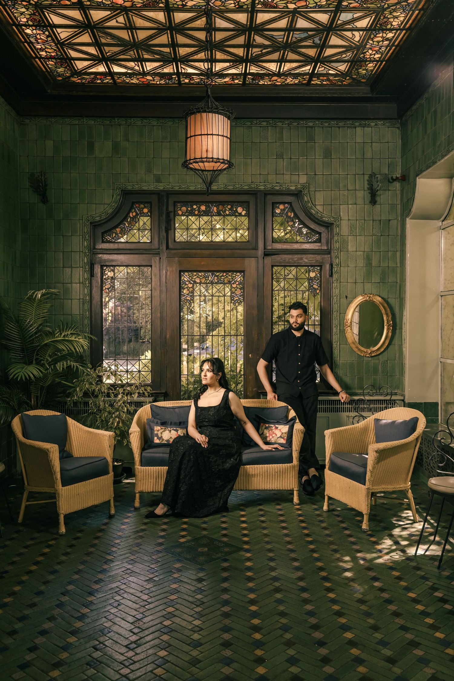 An artistic photo series in a vintage room with herringbone floors and elegant furniture.