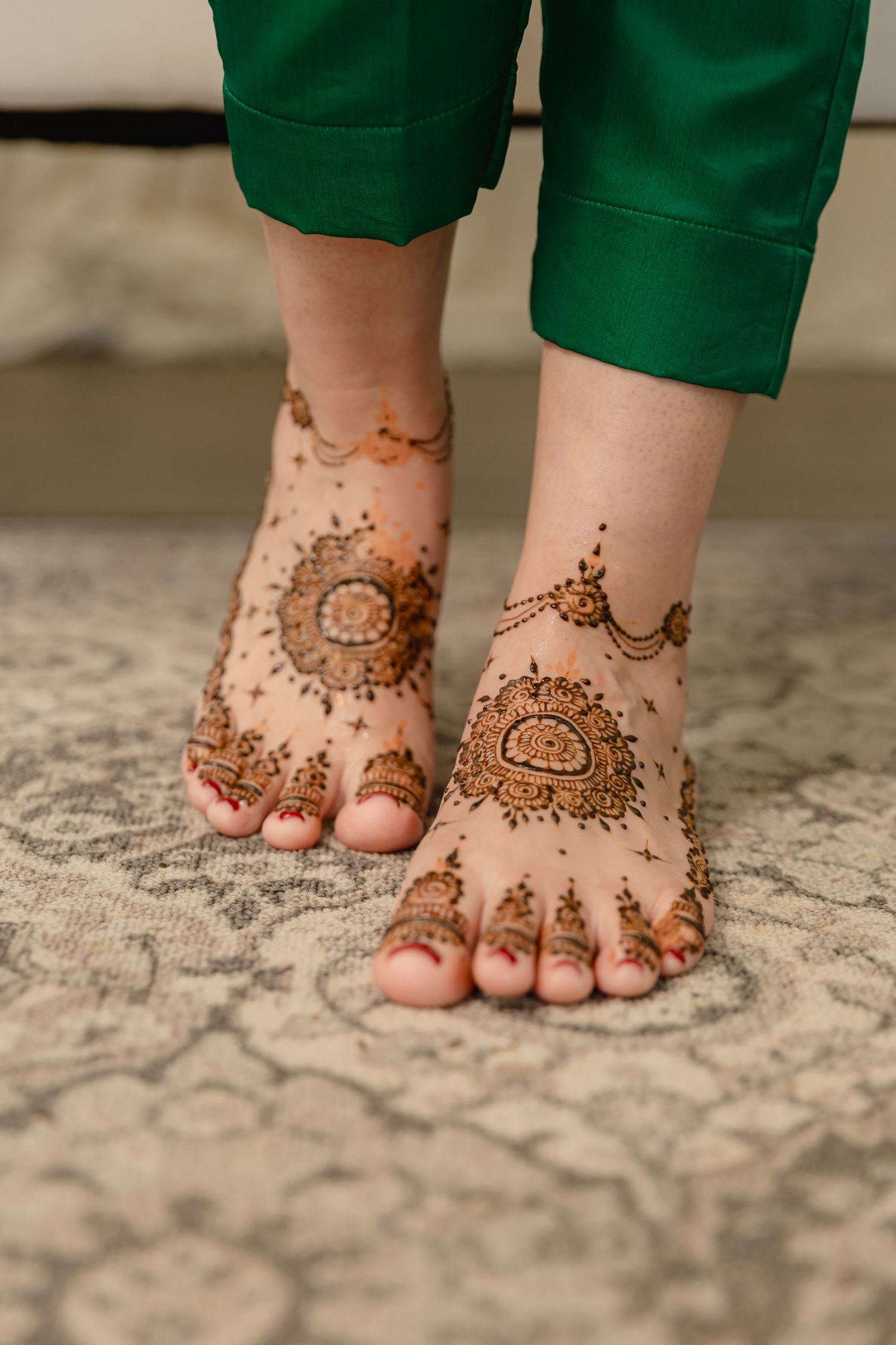 Intricate henna mehndi designs adorning feet with traditional patterns and motifs.