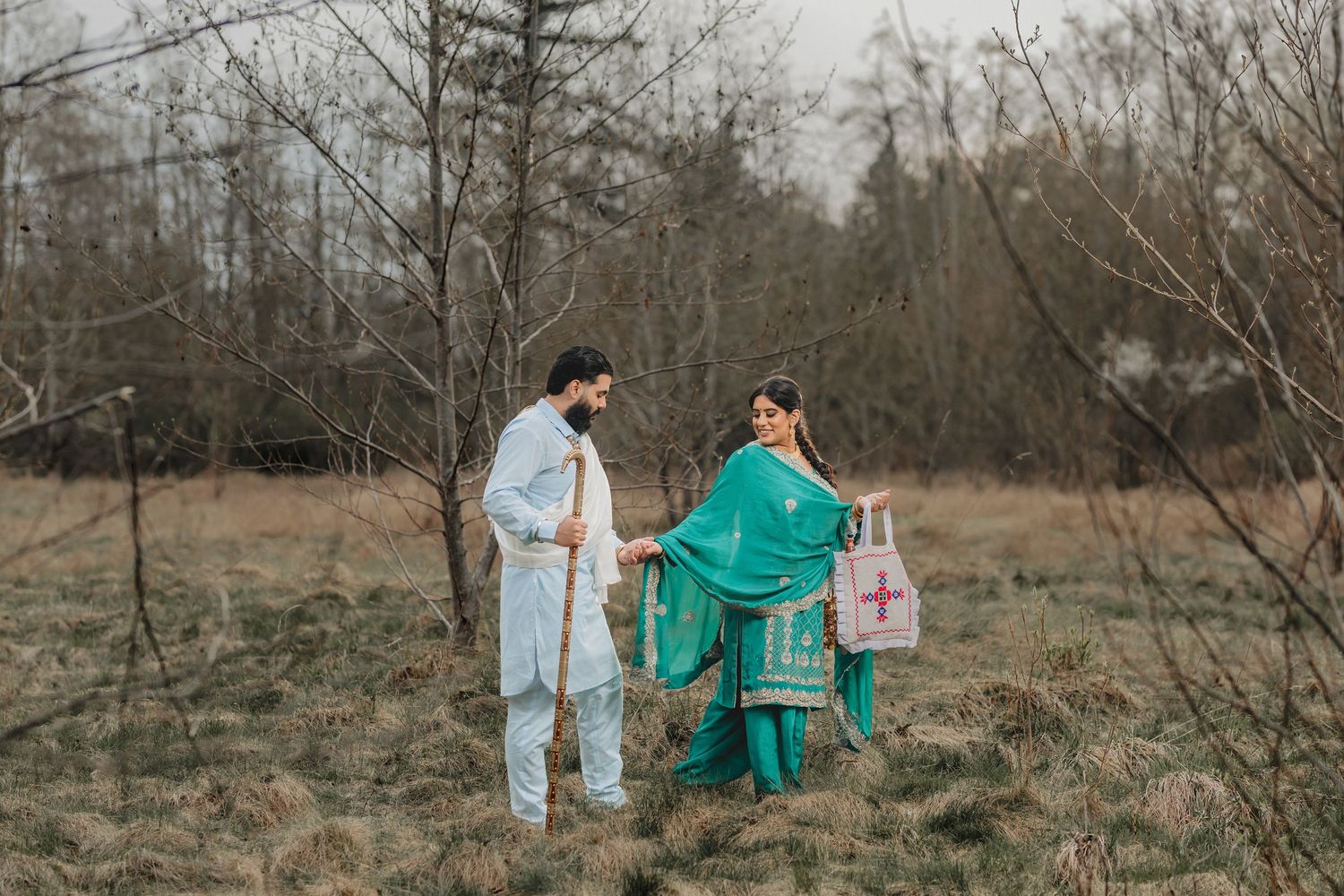 Vintage medical-themed couple's photoshoot in rustic field with dramatic lighting. Punjabi style Photoshoot