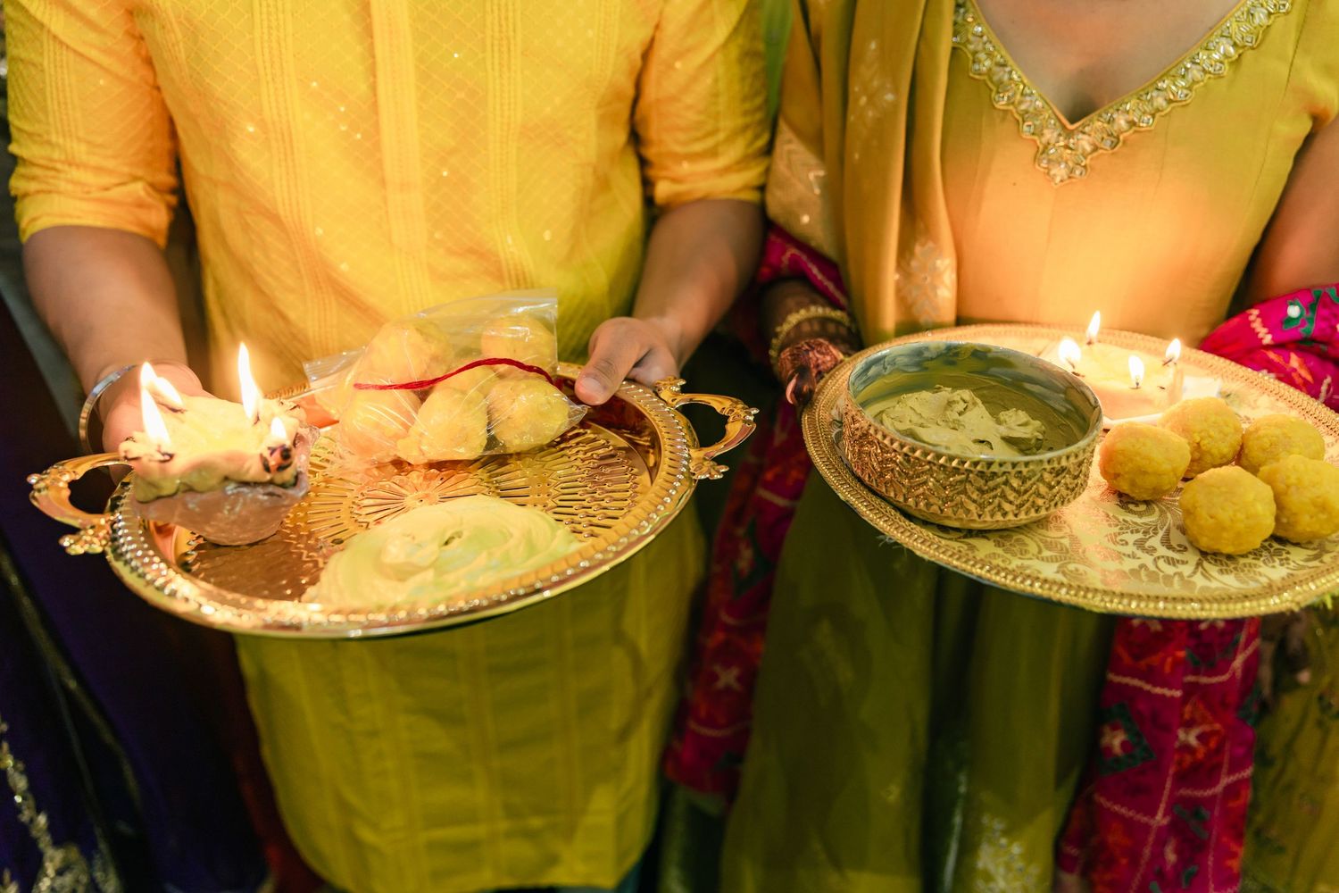 Yellow-themed wedding decor and table settings with floral arrangements.