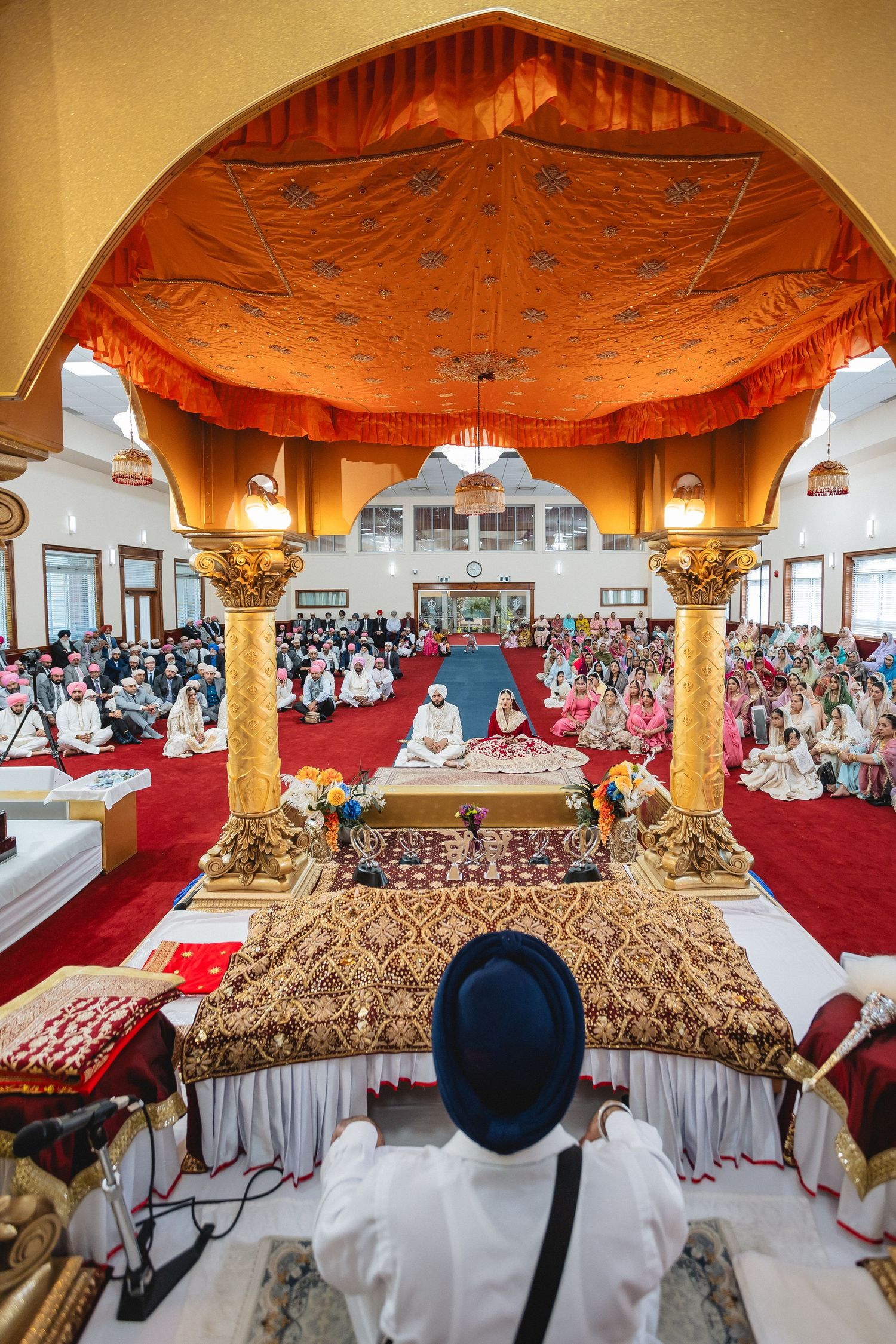 Ornate ceremonial space with golden arched ceiling and decorative elements.