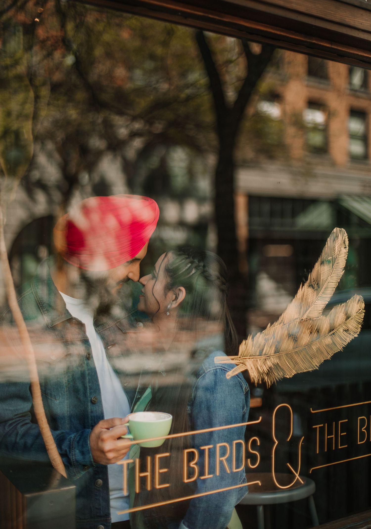 Artistic window reflection shots through cafe glass with 'The Birds' text visible.