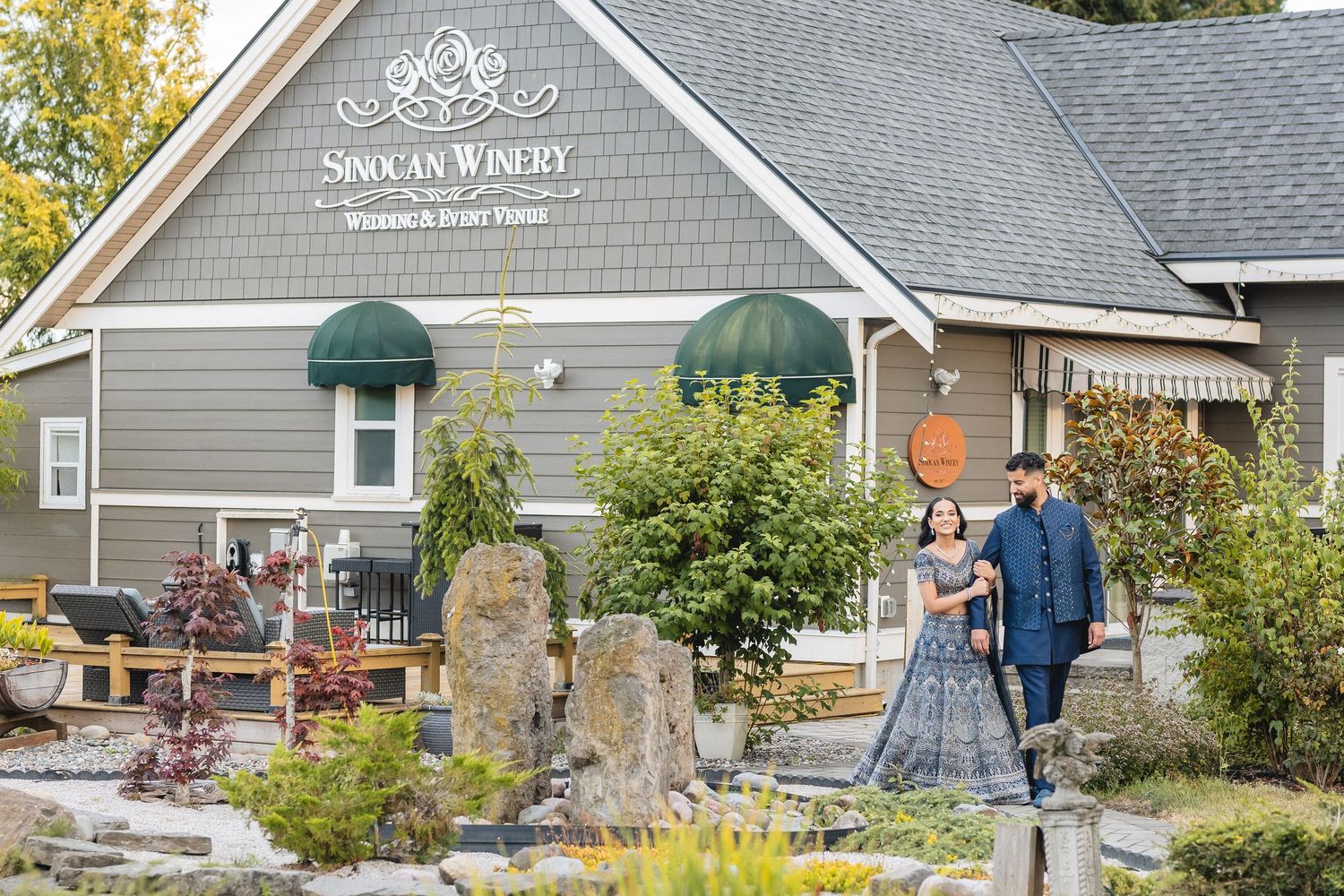Exterior view of Simola Winery building with gray siding and white trim.