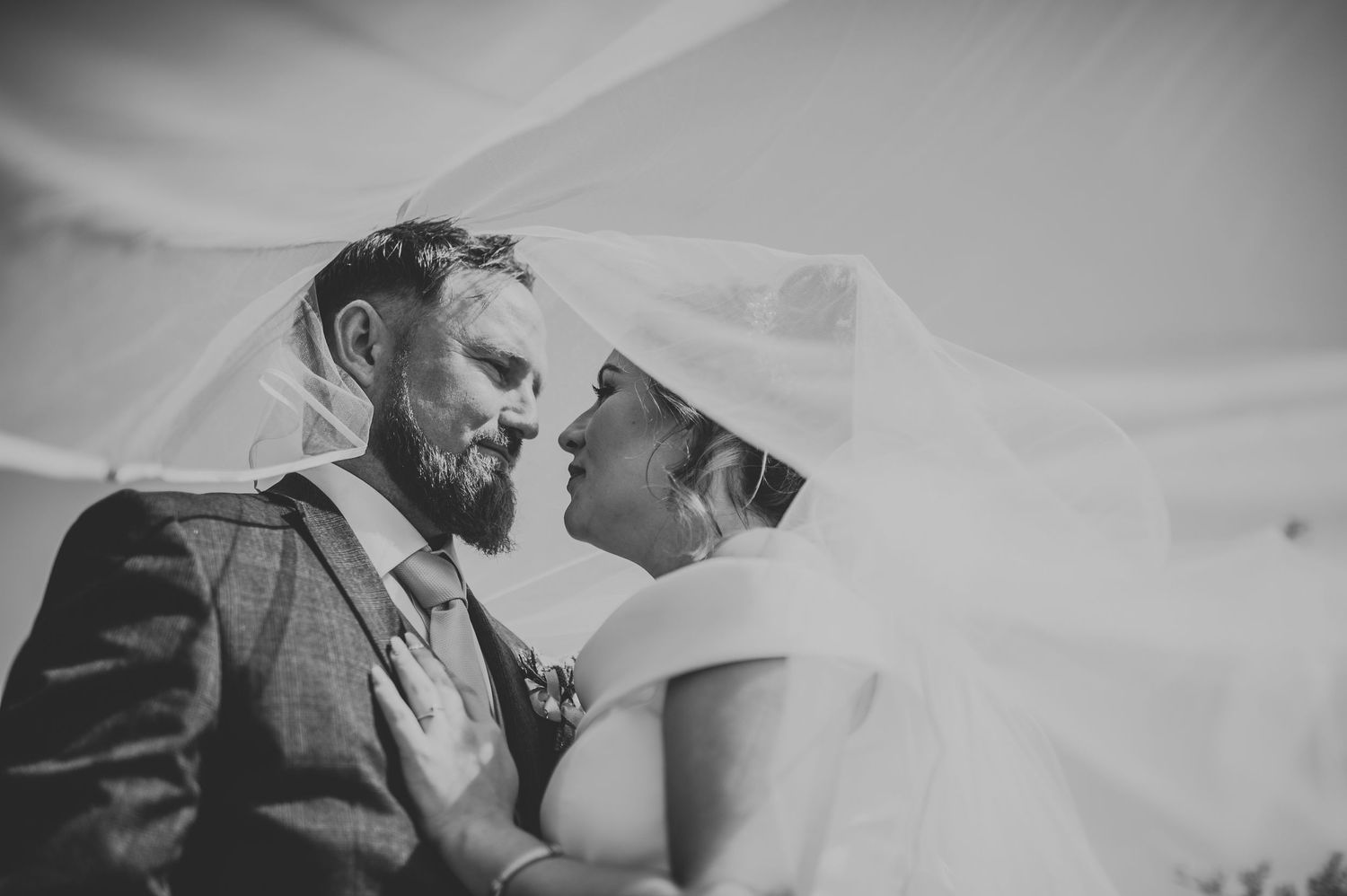 Black and white romantic wedding photos showing tender moments.