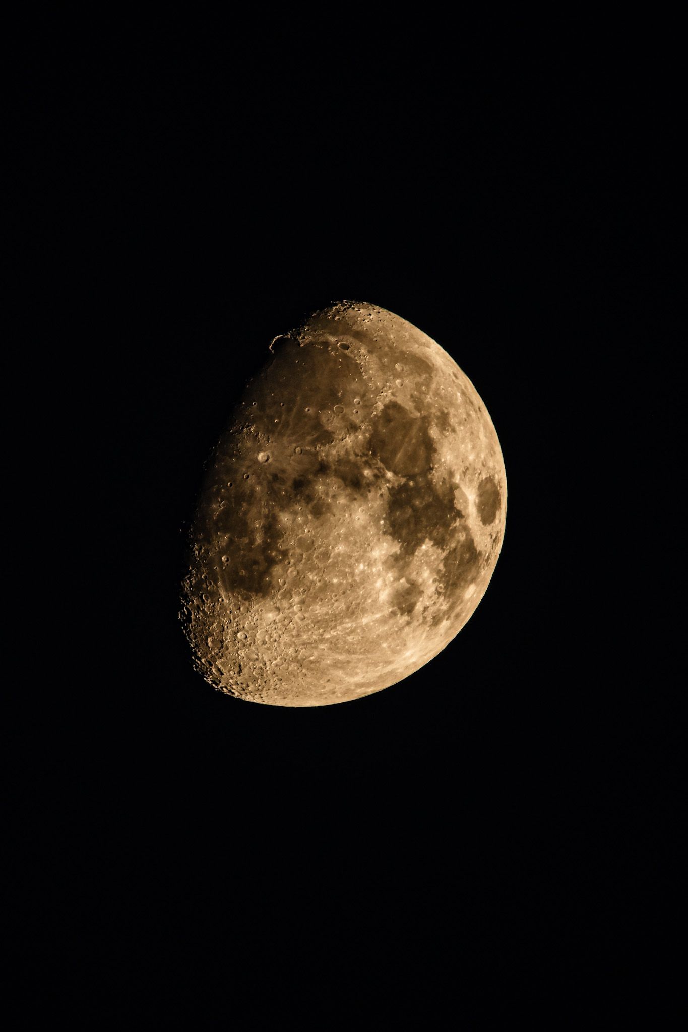 Different phases of the waxing moon shown against a dark night sky.