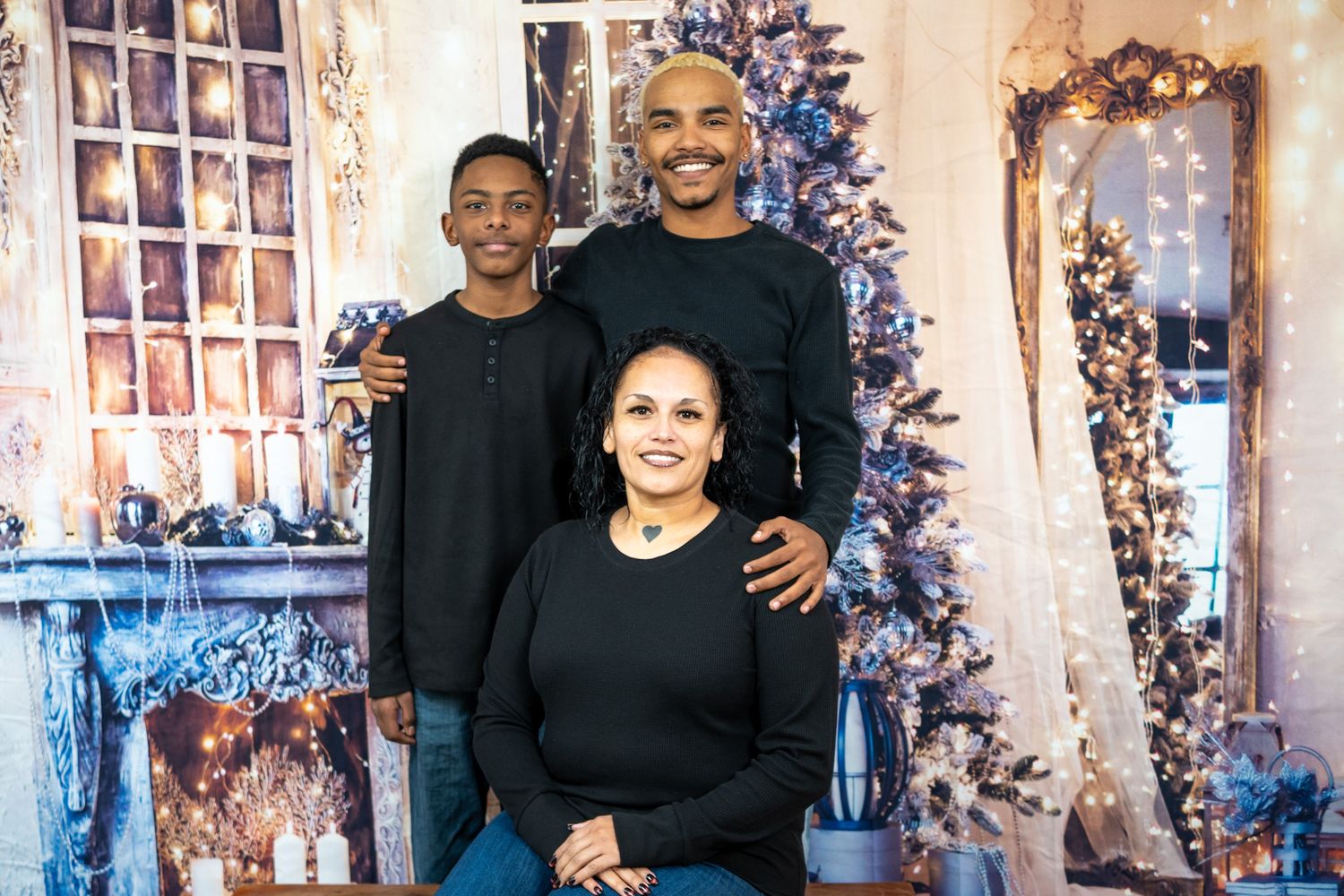 A series of holiday portraits with people posing in front of a decorated Christmas tree and white backdrop.
