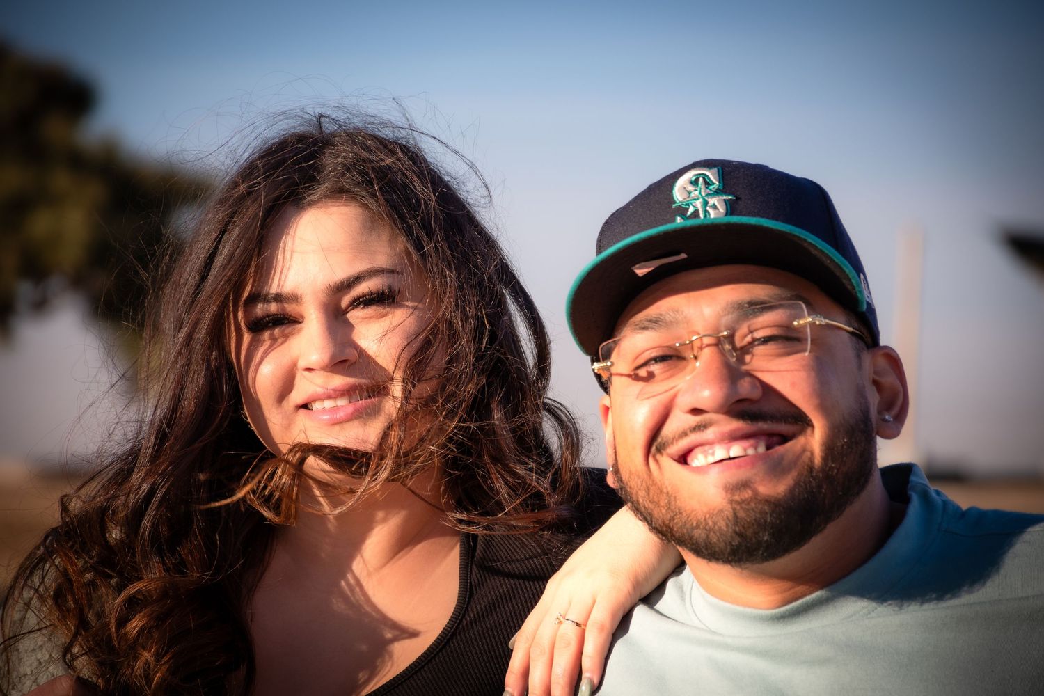 A sequence of casual outdoor portraits showing people smiling and laughing together during golden hour lighting.