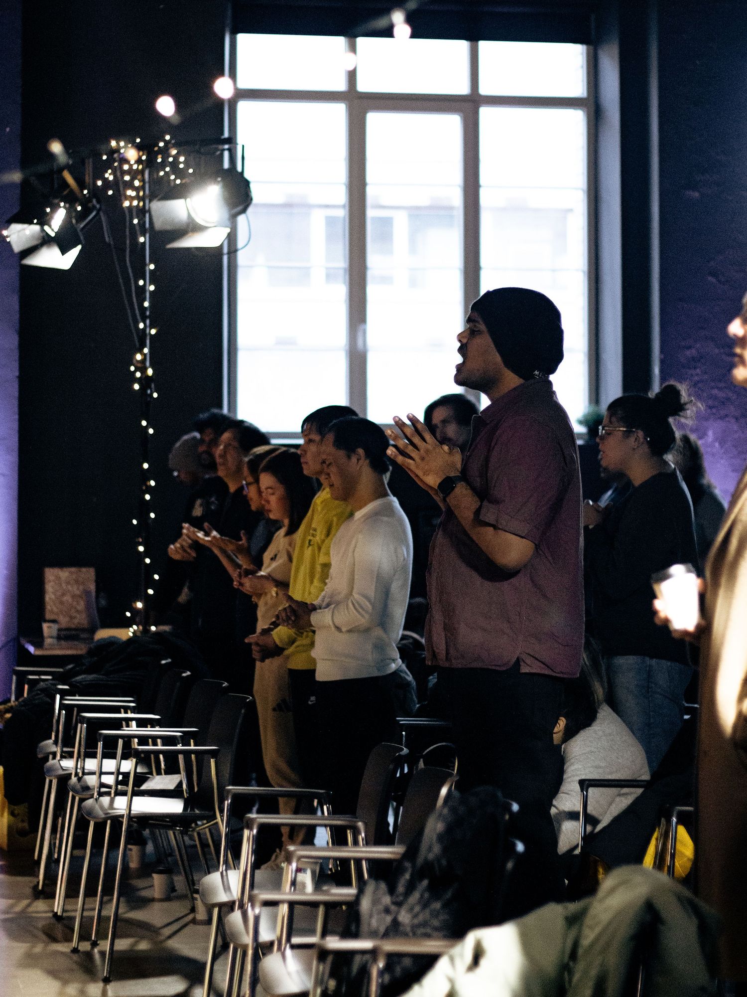 Church congregation standing in worship.