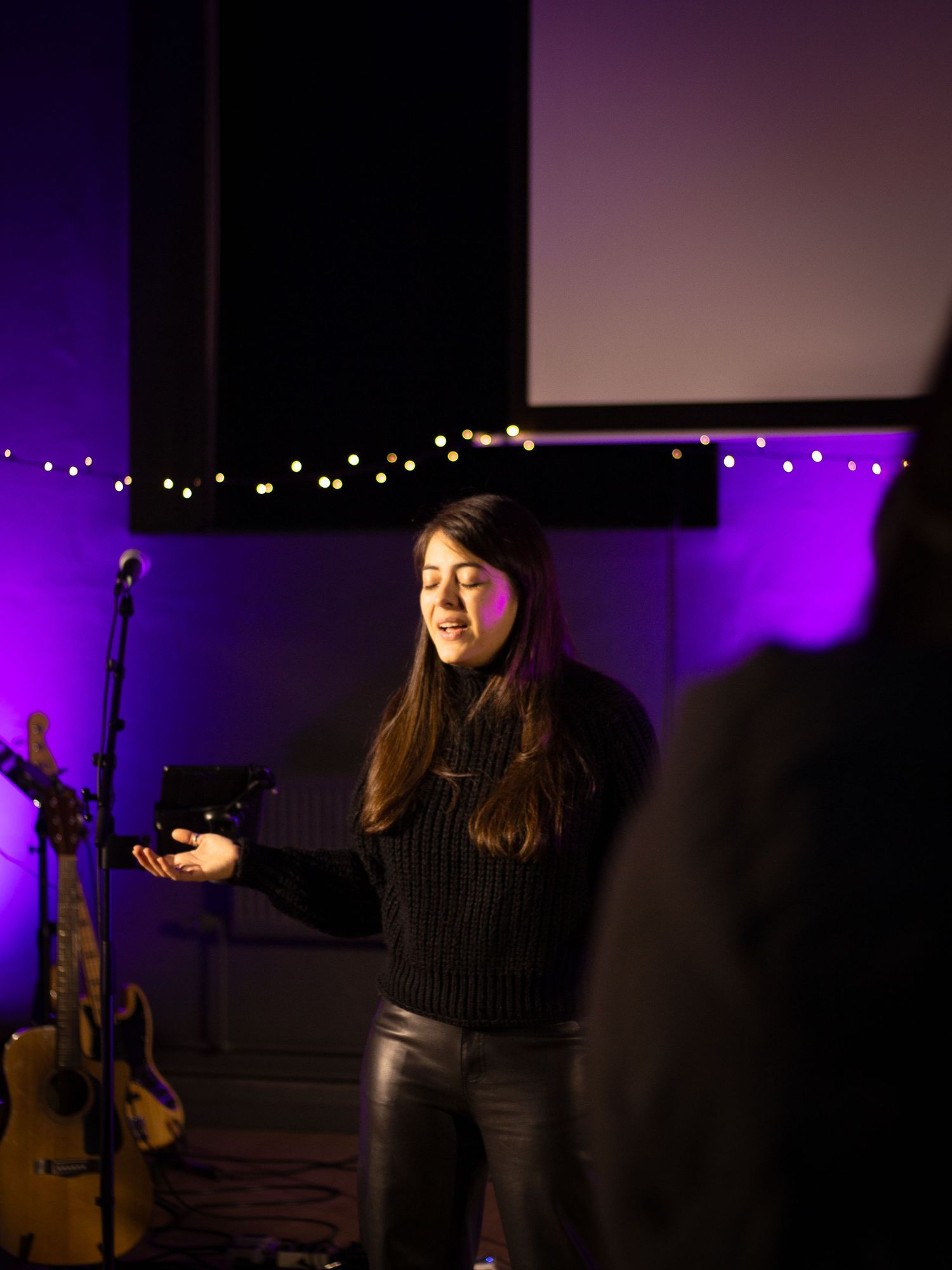 Woman leading worship.