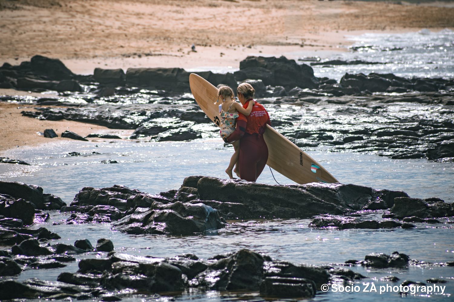 Surfer in the water on the beach in the Eastern Cape in Jeffreys Bay.