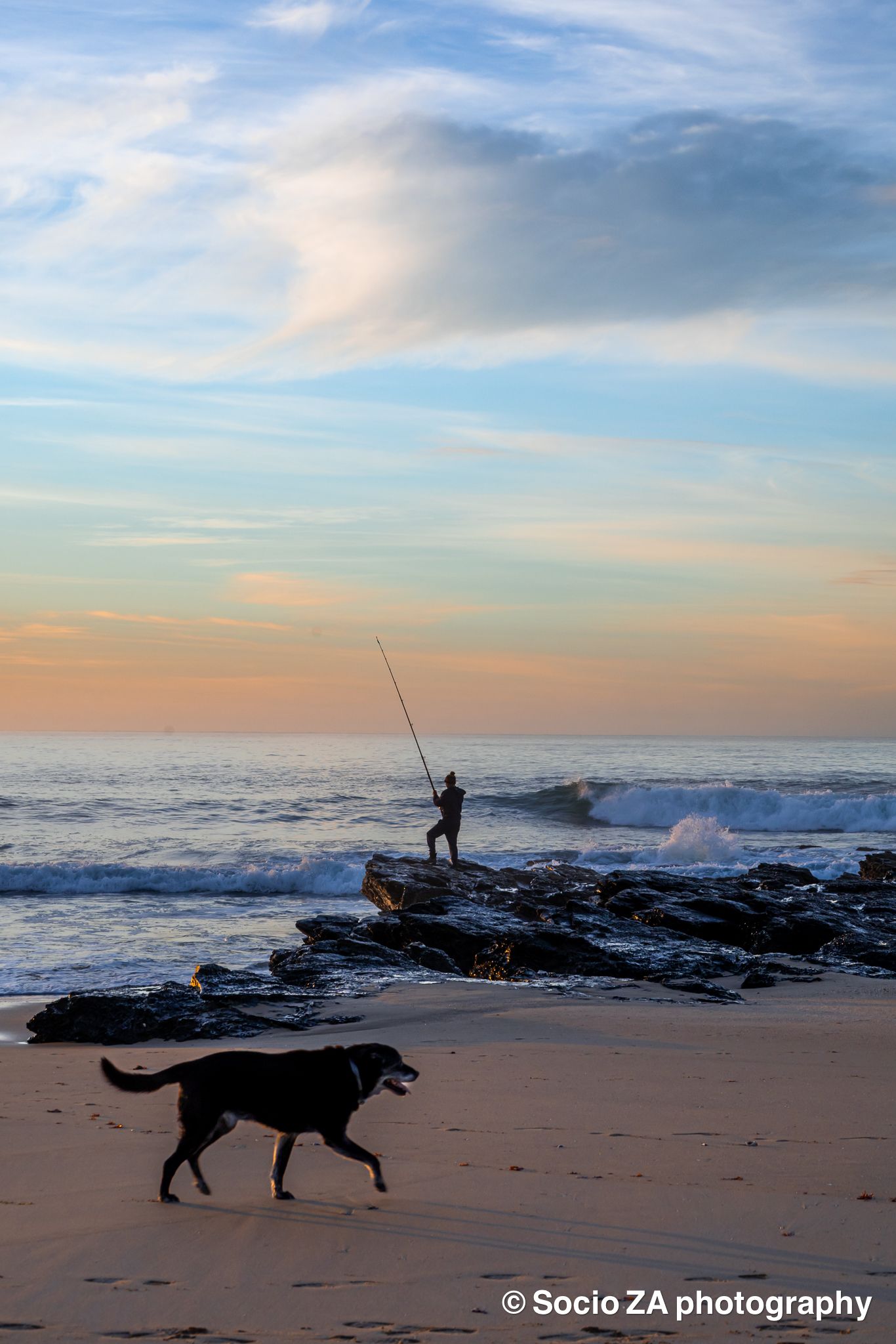 Sunrise at the beach in Jeffreys Bay Eastern Cape. Landscape photography. Fisherman with dog.