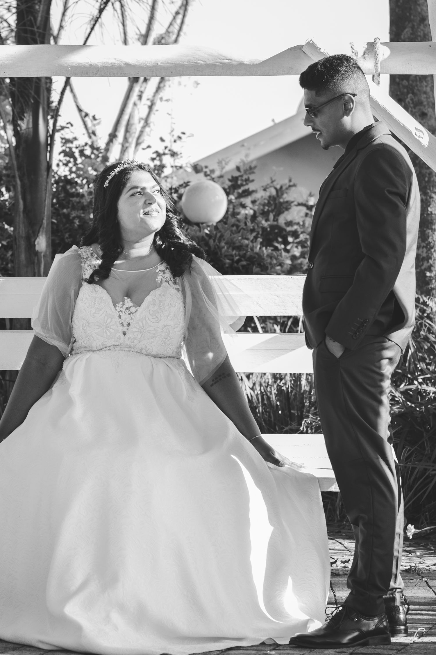 A couple enjoying a photoshoot during a white wedding.