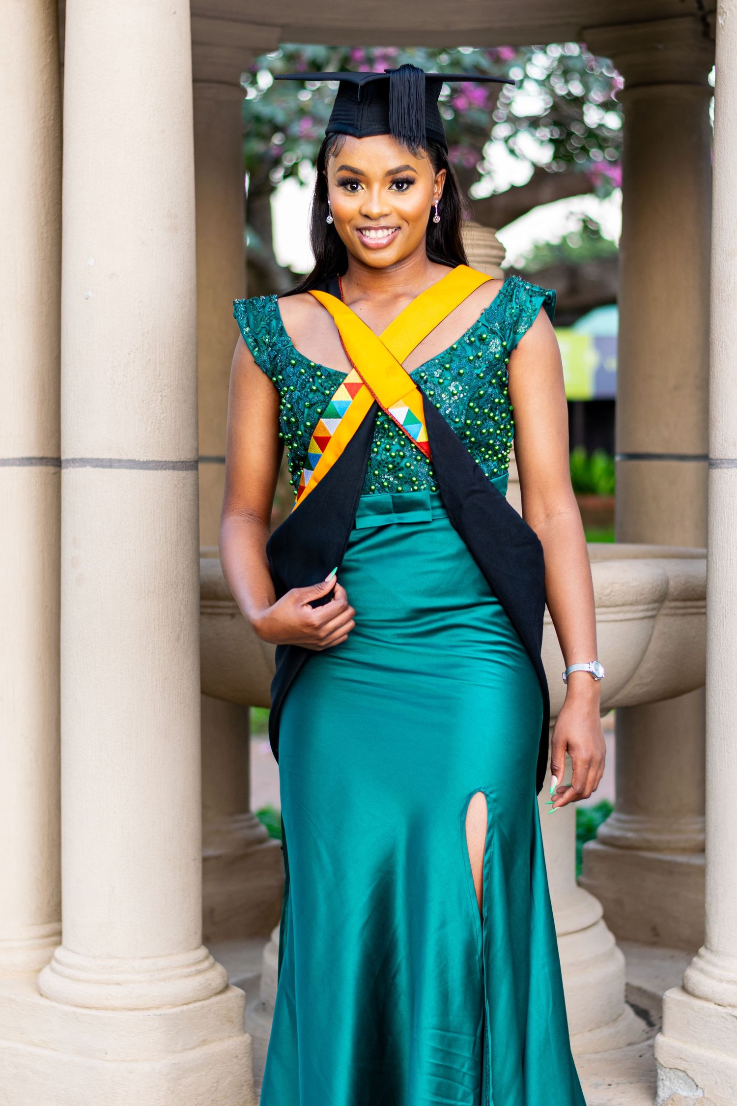 A woman poses for an image of the graduation photoshoot held in Durban.