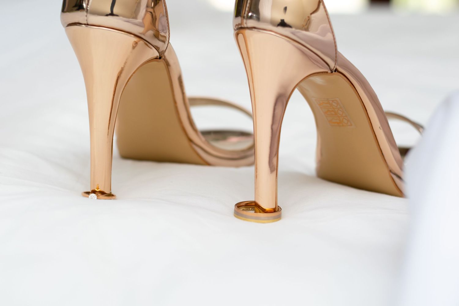 The bride's shoes in a white wedding ceremony.