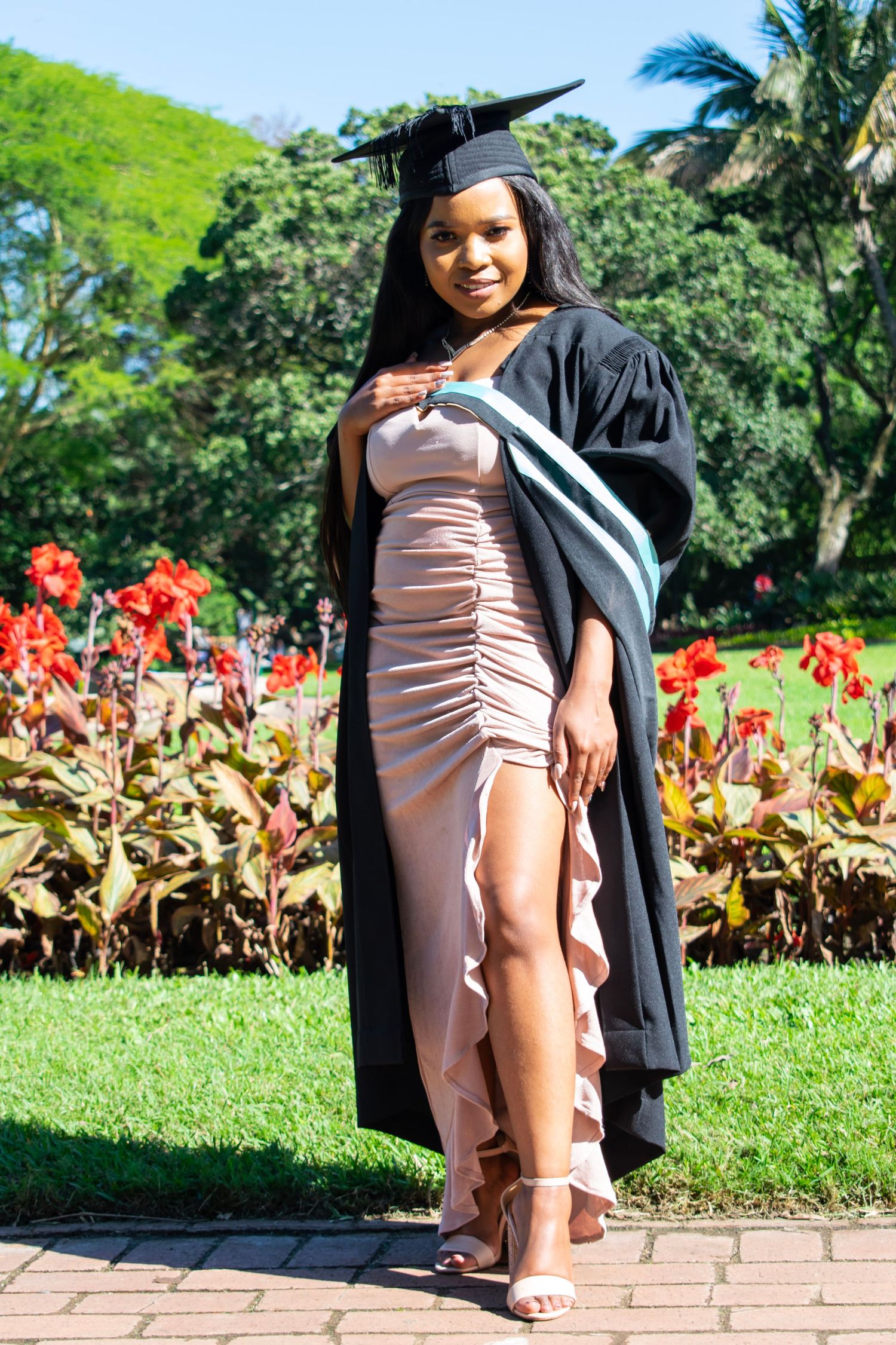 An image of a woman in a graduate photoshoot held in botanic gardens, Durban.