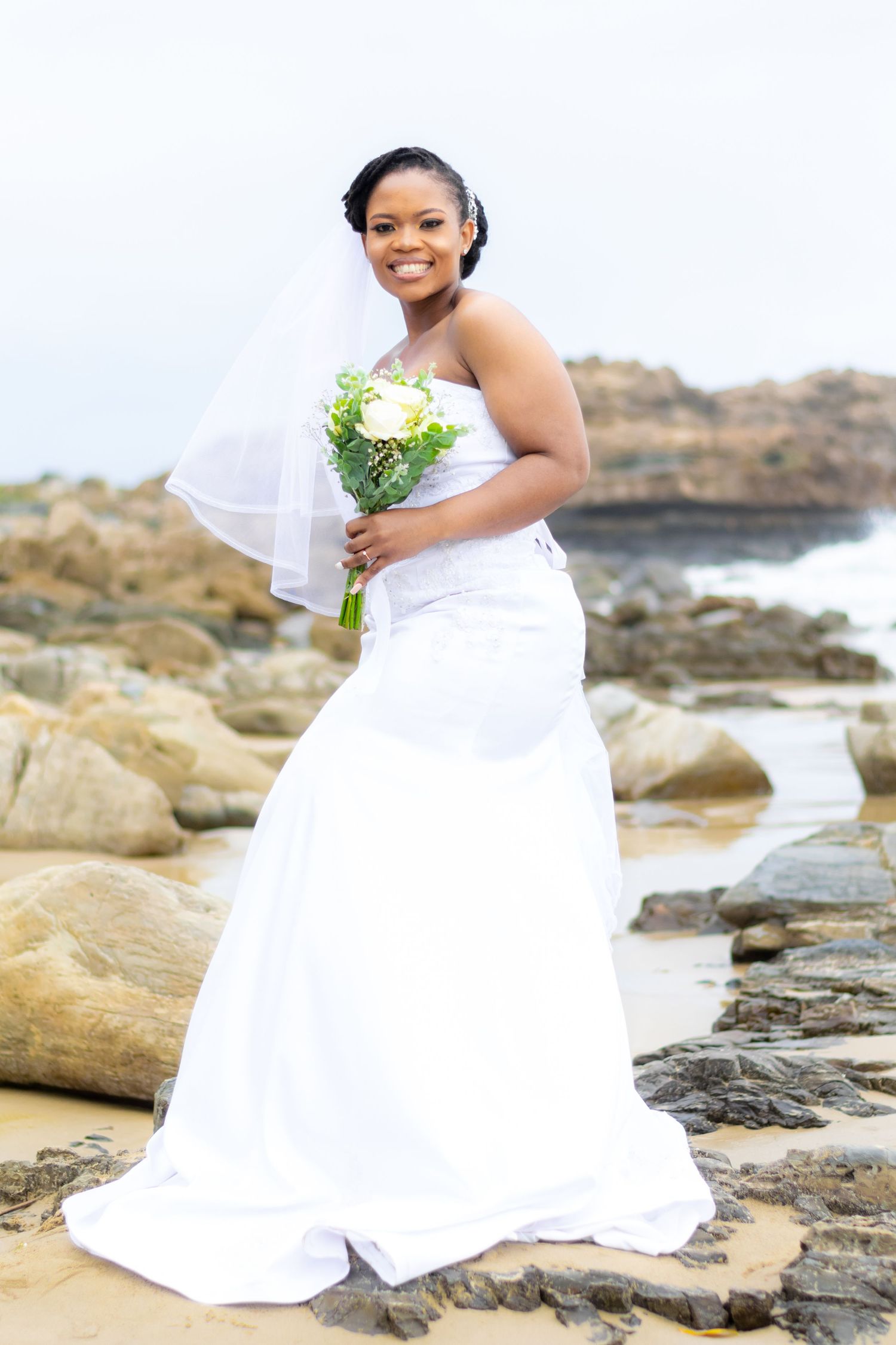 The bride posing for an image in a white wedding held in Eastern Cape.