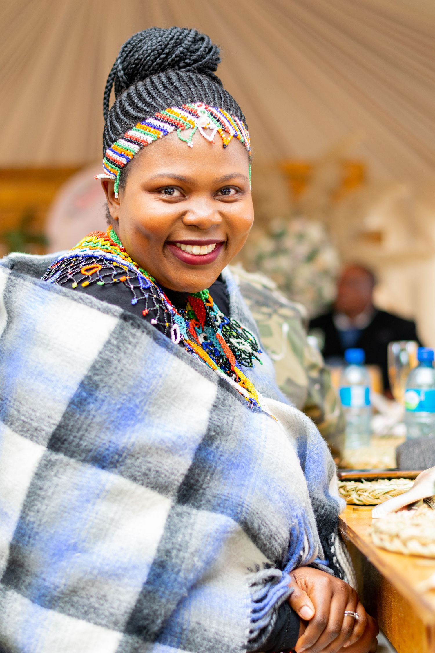 A woman smiling during a traditional event held in Eastern Cape.