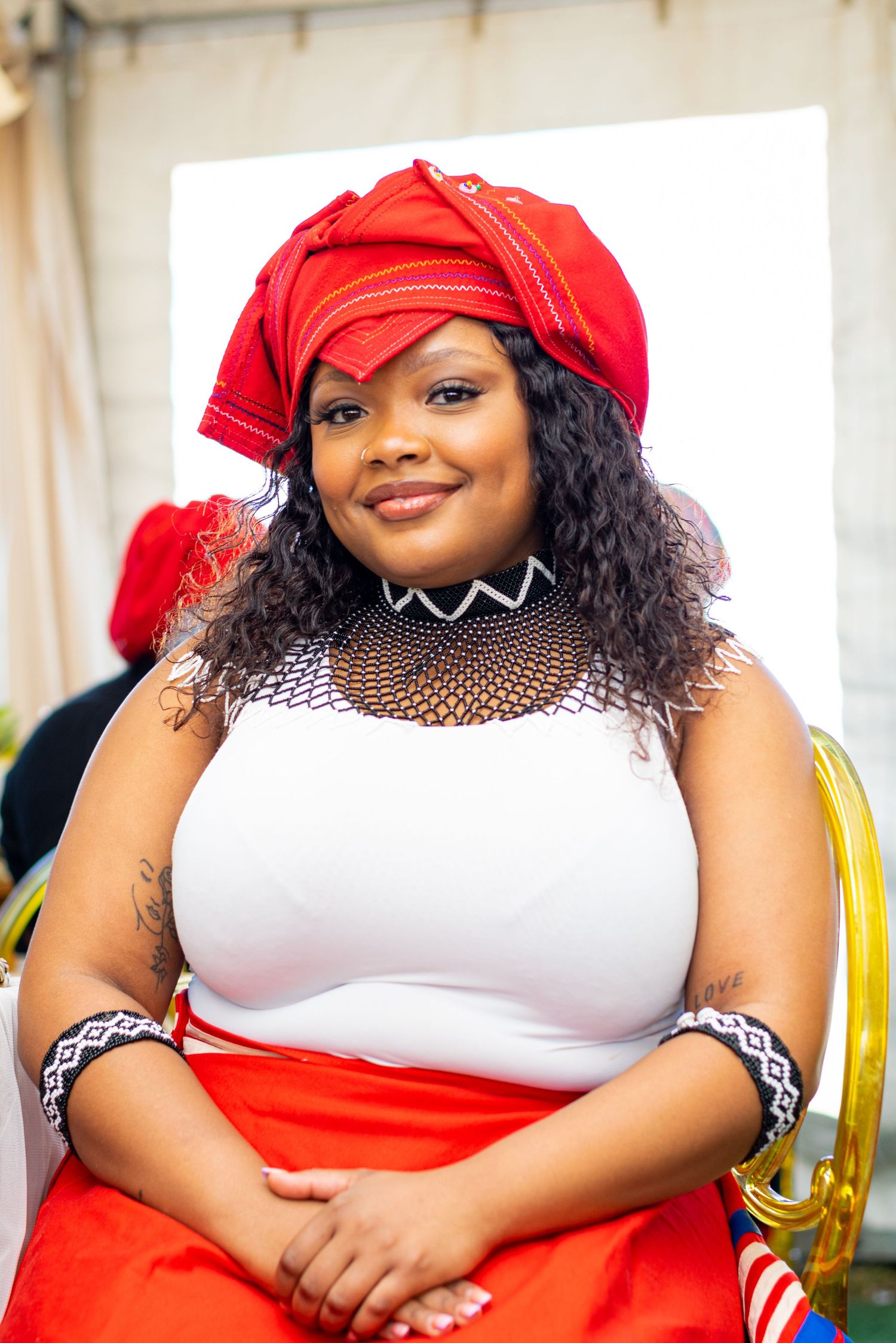 Woman wearing a traditional attire during a traditional ceremony.