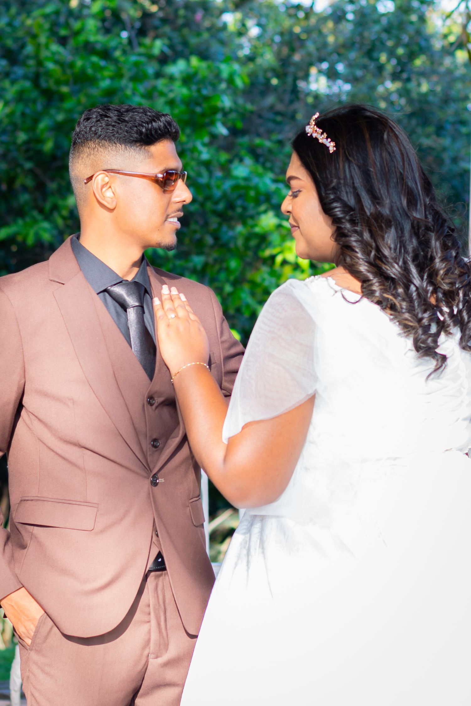 A couple poses for a photoshoot during a white wedding ceremony heldin Durban.