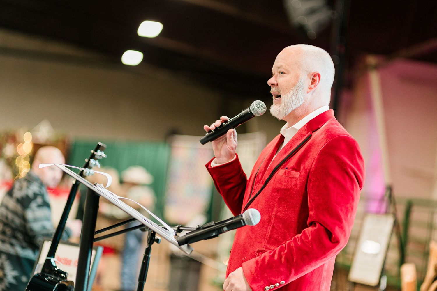 An emcee speaking at an event in Bend, Oregon