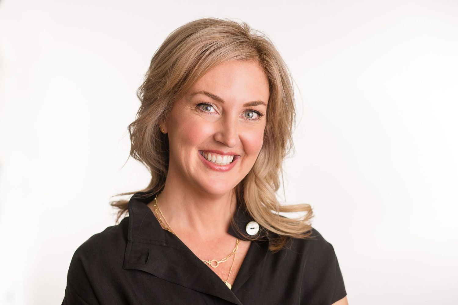 Headshot of a woman in a studio setting