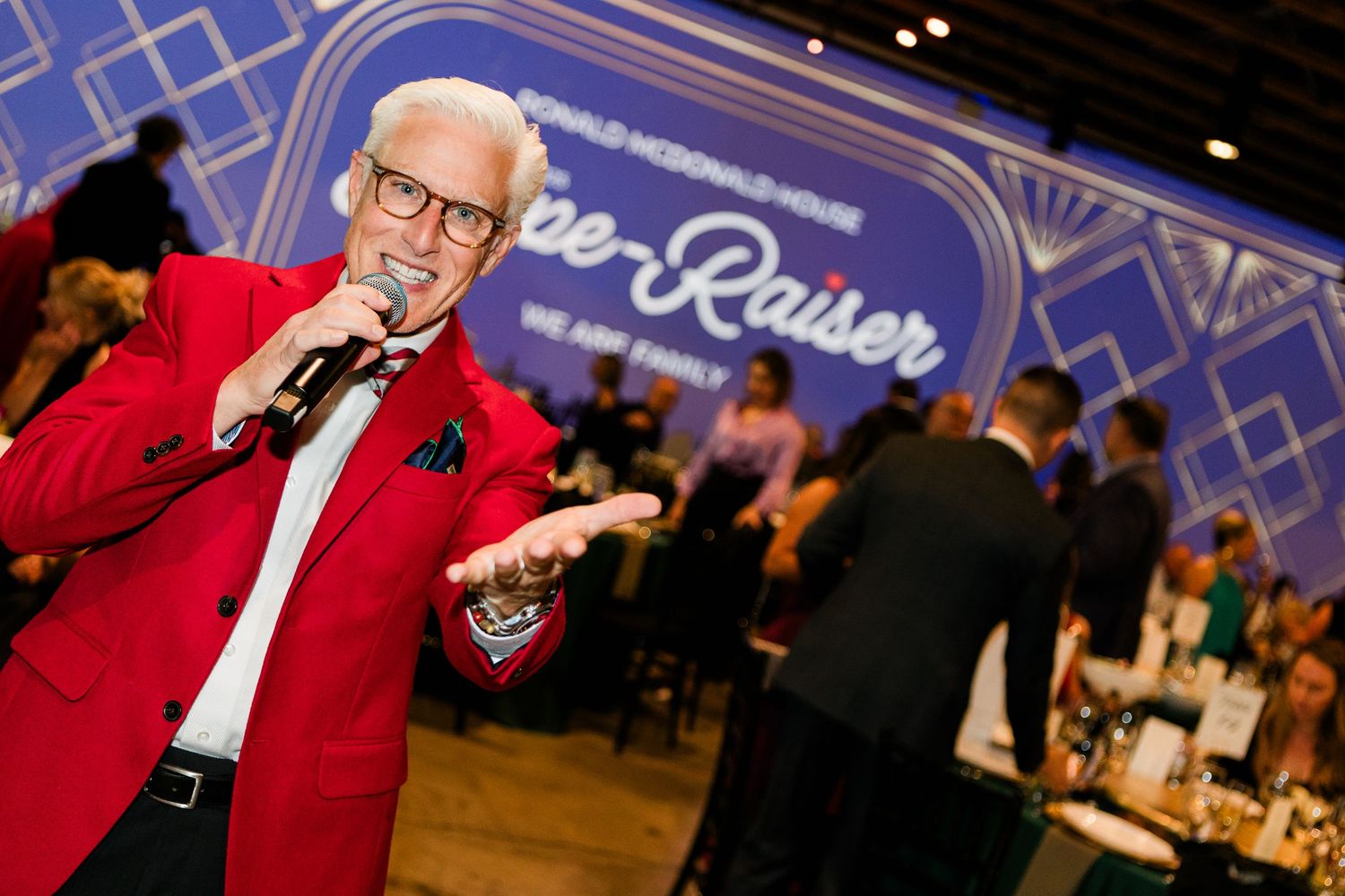 An emcee speaking at an event in Portland, Oregon