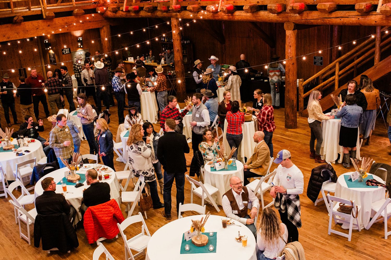 Wide shot of people enjoying an event at the Great Hall in Sunriver, Oregon