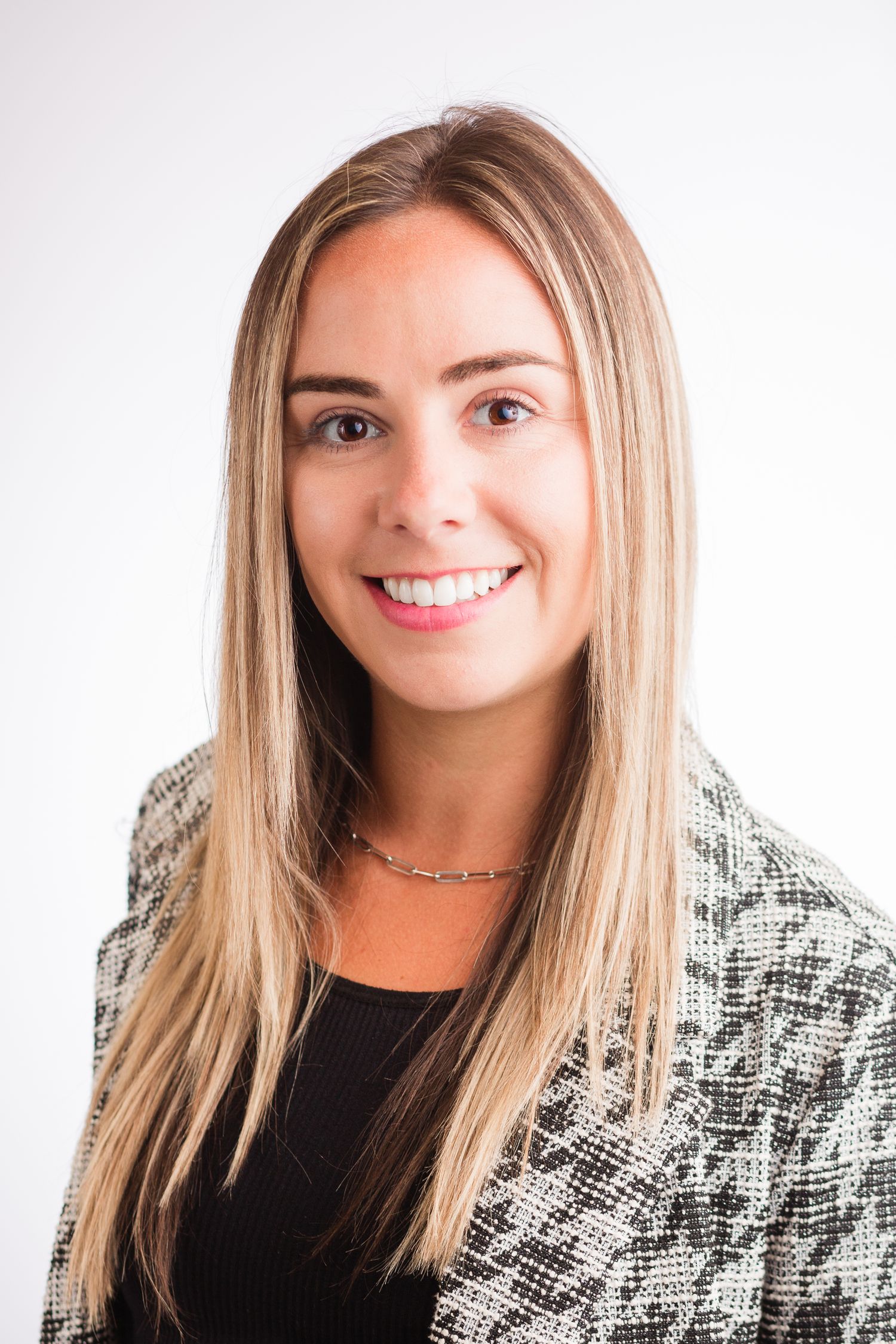 Headshot of a woman in a studio setting