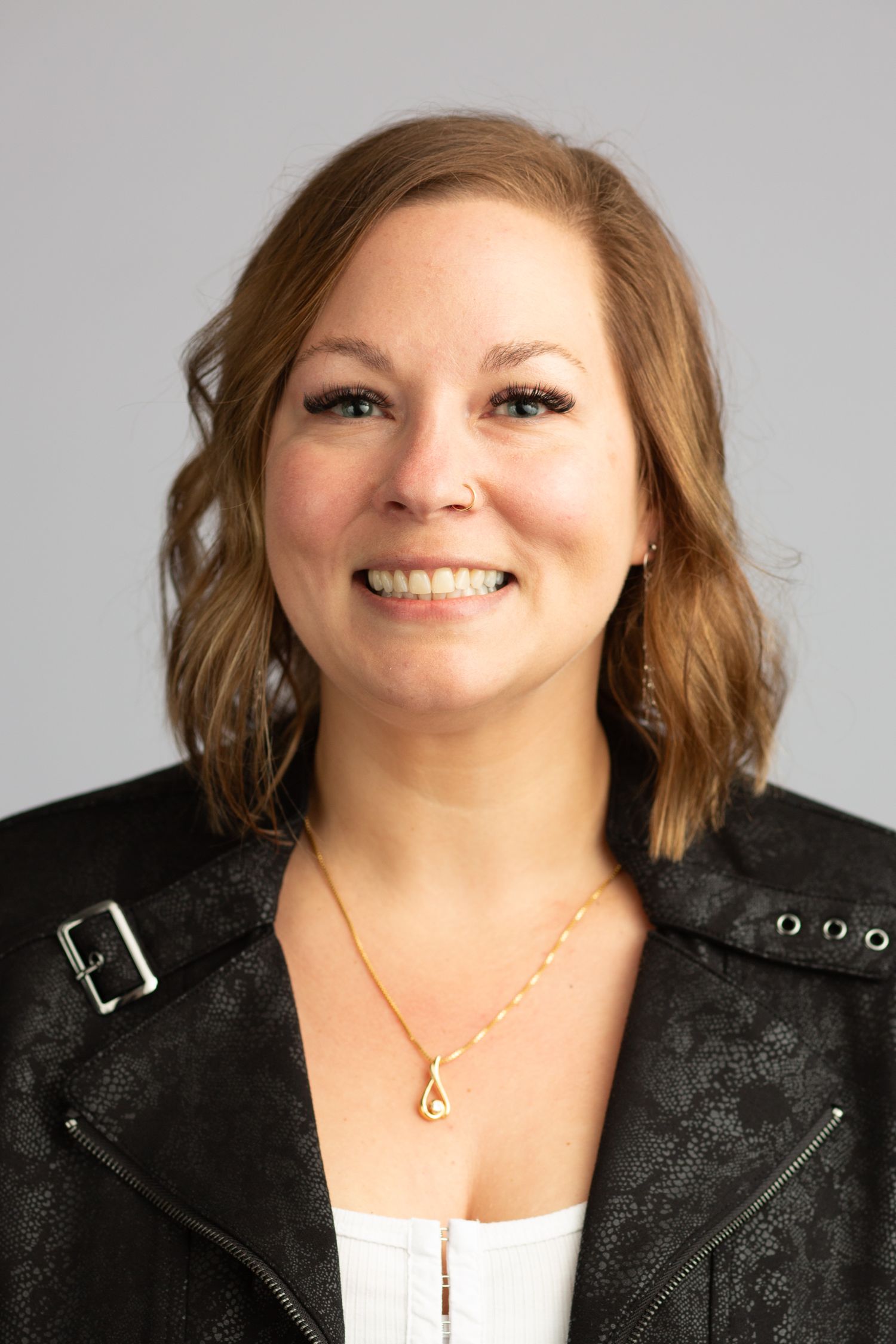 Headshot of a woman in a studio setting