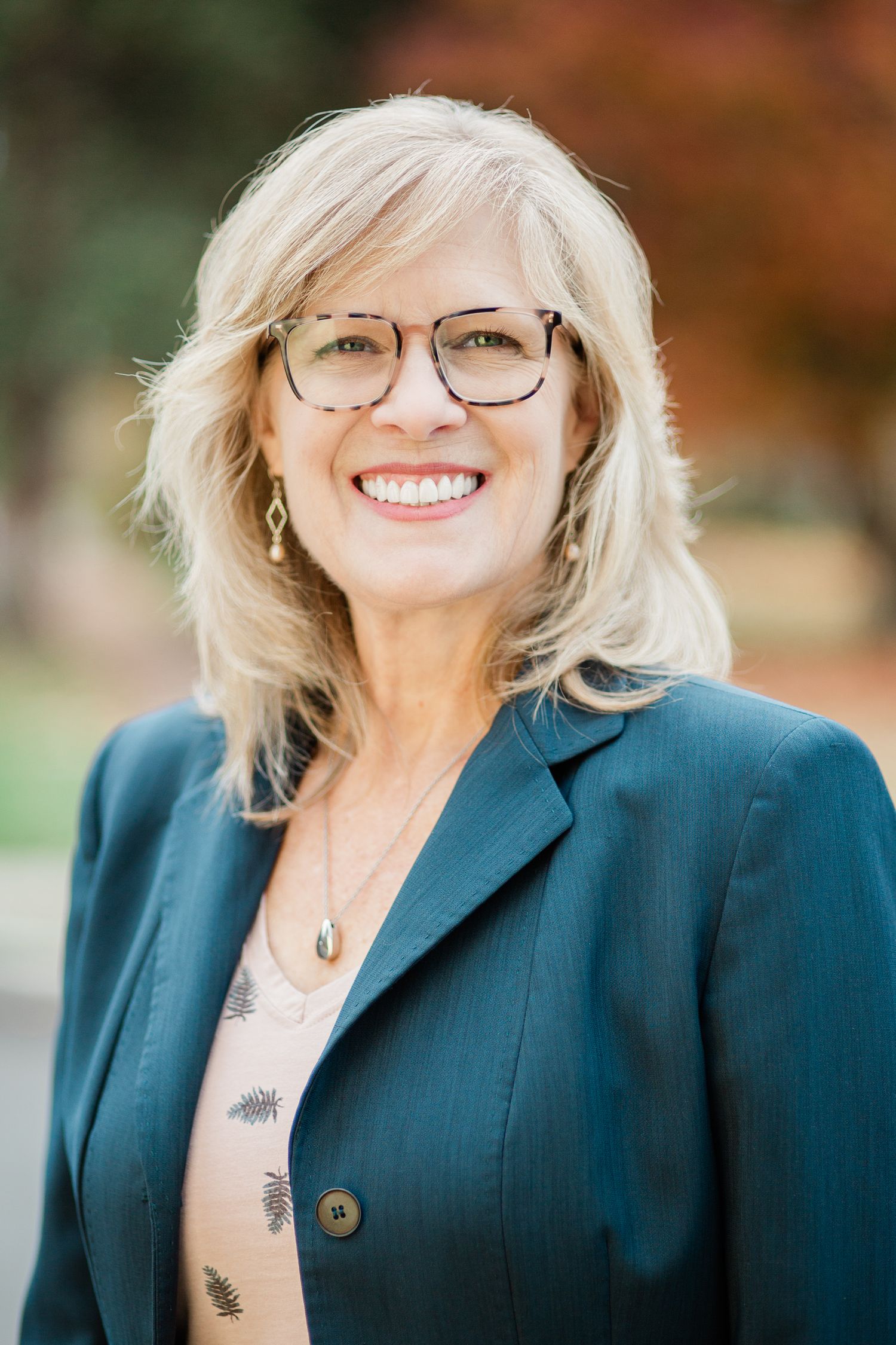 Headshot of a woman in a natural setting