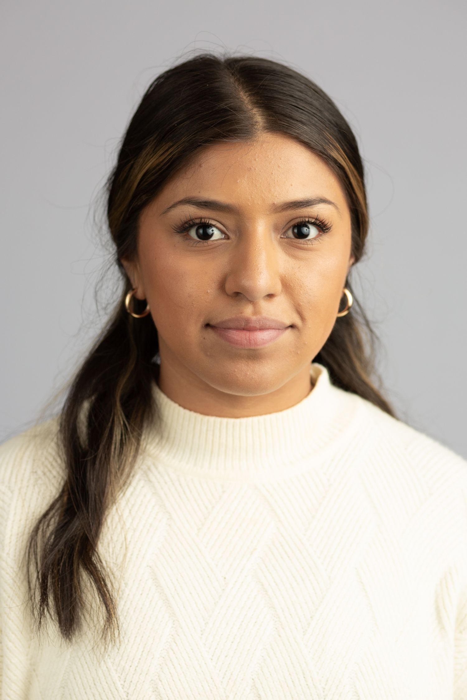 Headshot of a woman in a studio setting