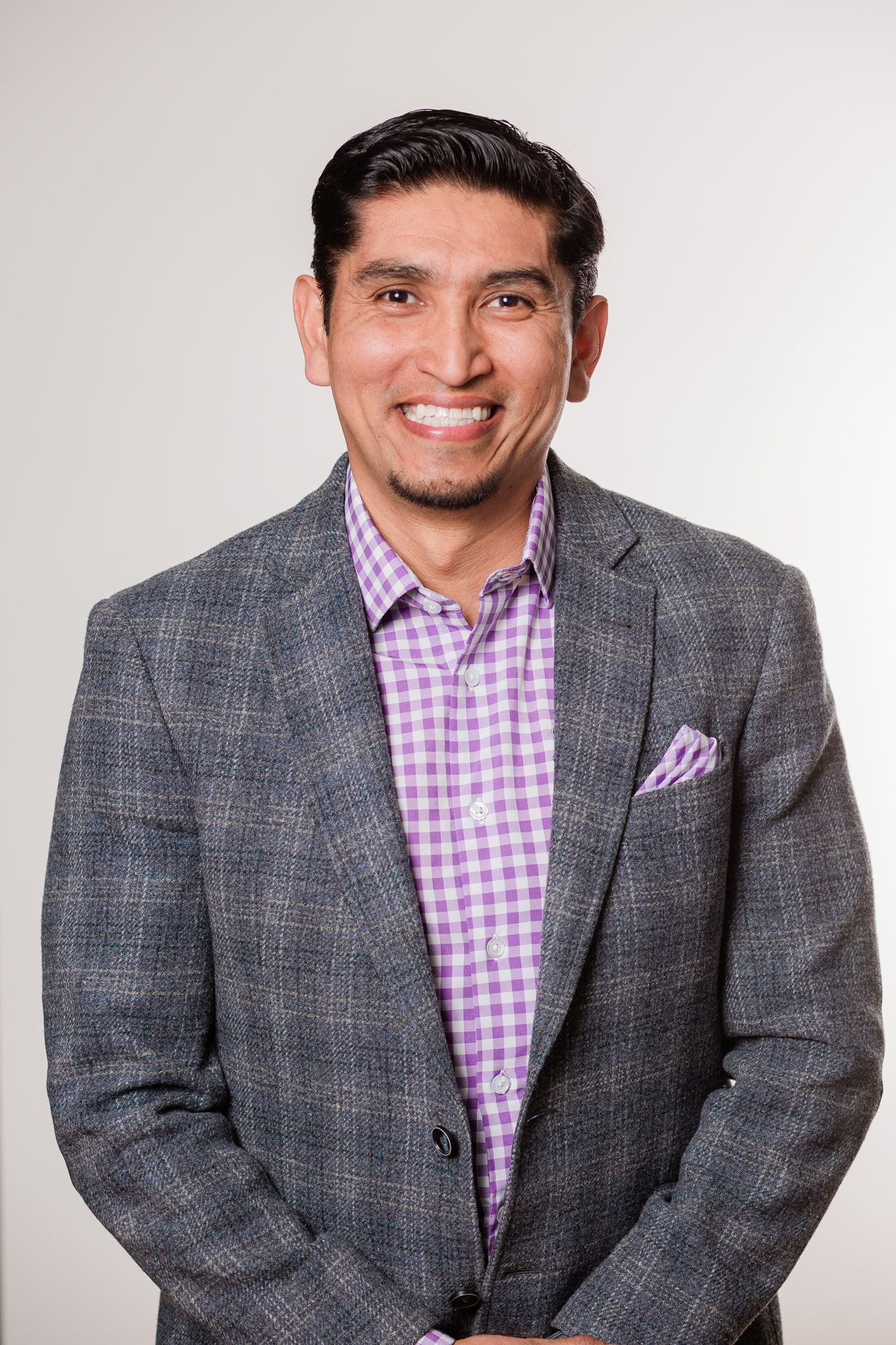 Headshot of a man in a studio setting