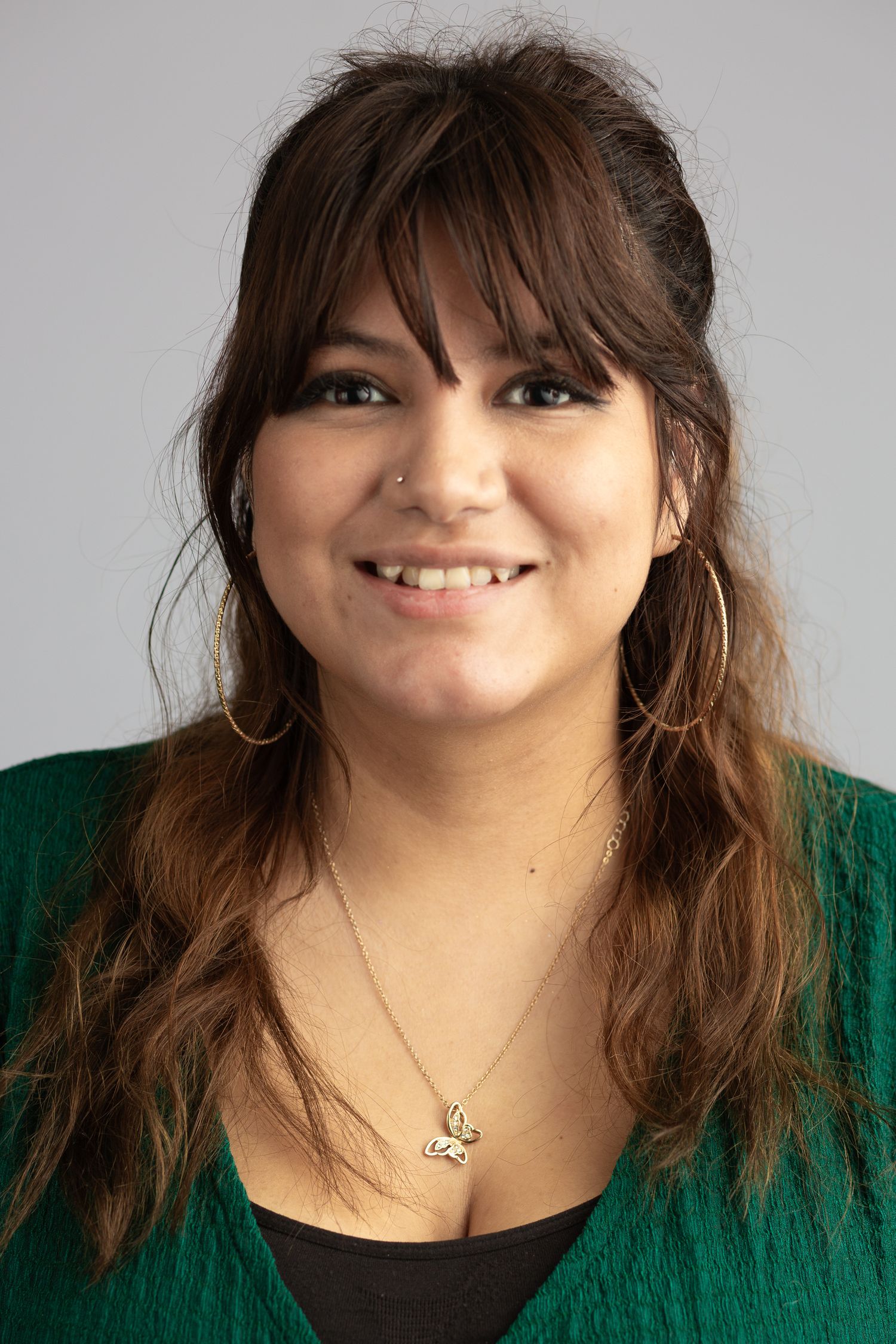 Headshot of a woman in a studio setting