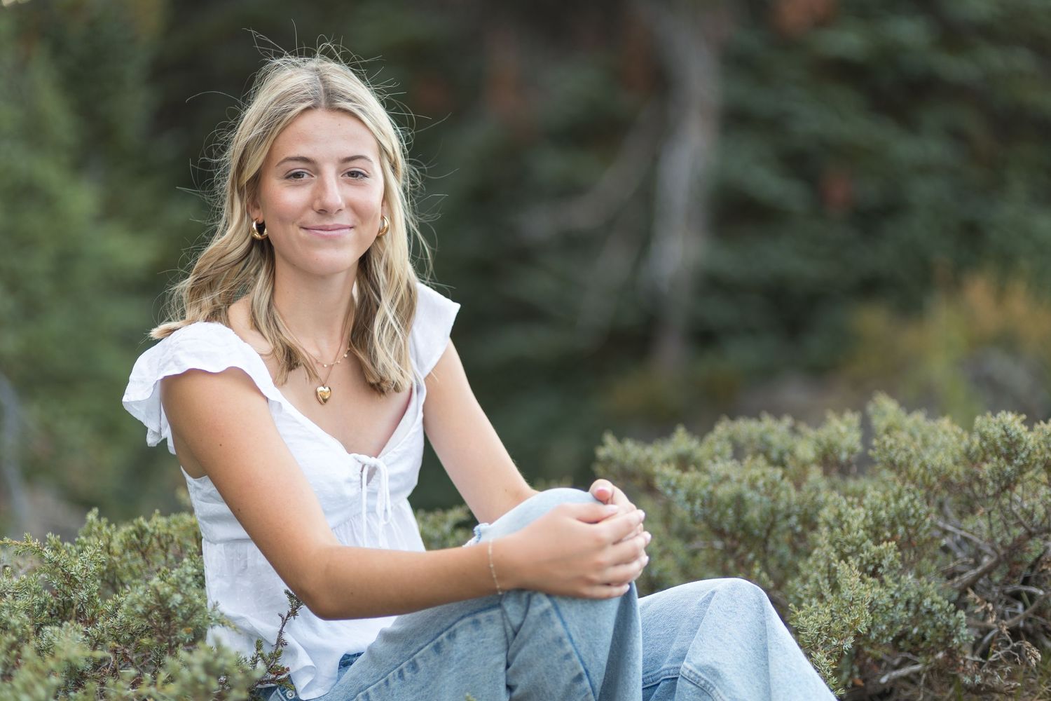 Senior portrait of a young woman at Sparks Lake