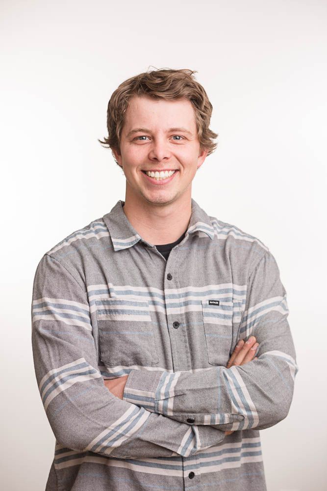 Headshot of a man in a studio setting