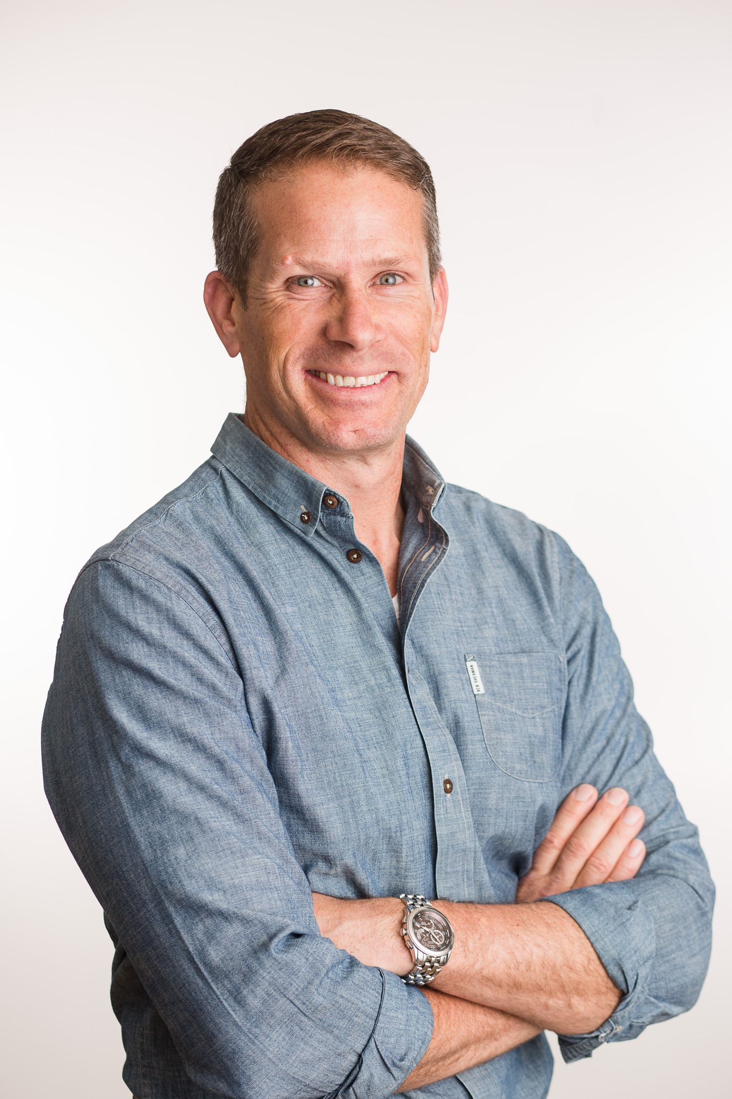 Headshot of a man in a studio setting