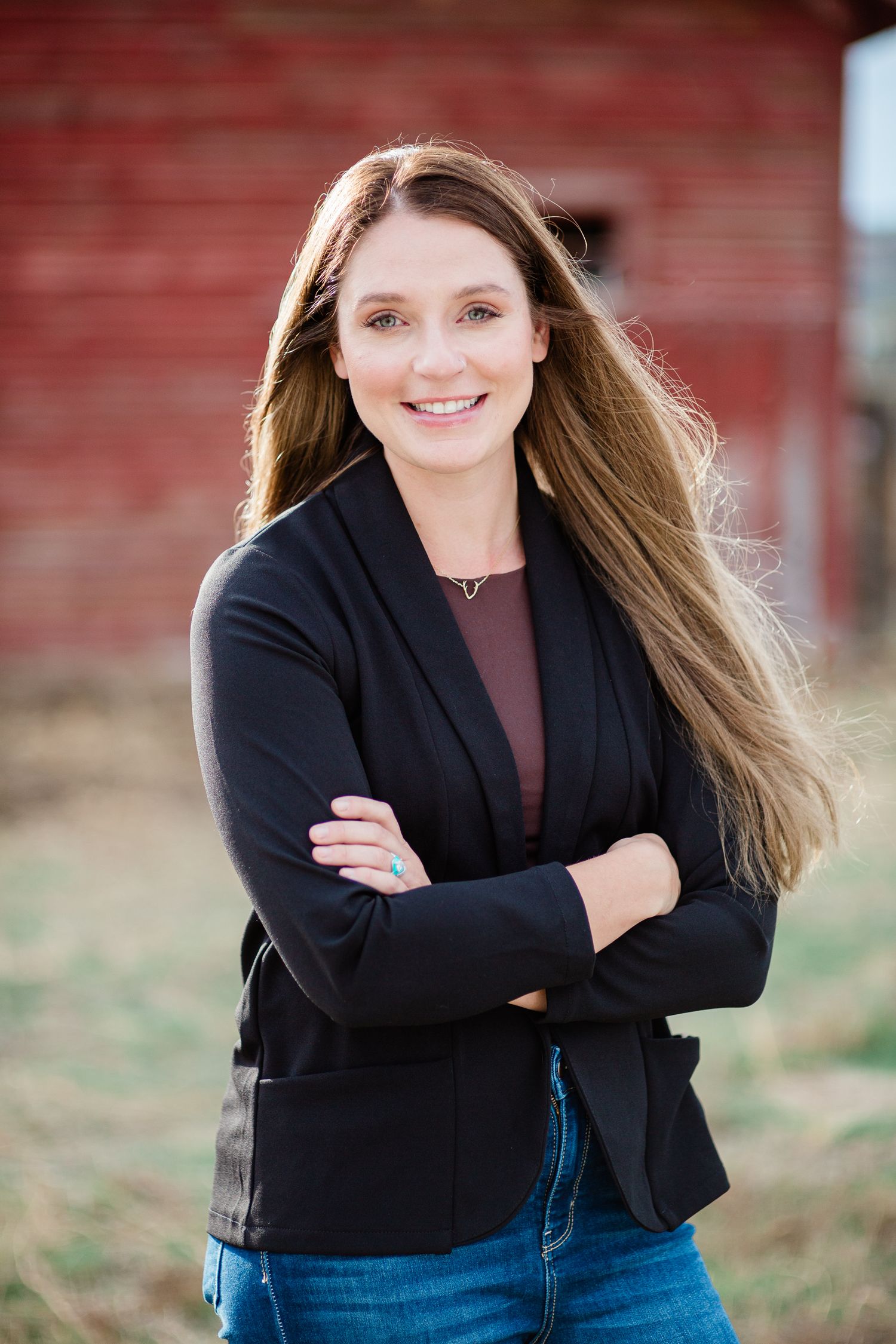 Headshot of a woman in a natural setting