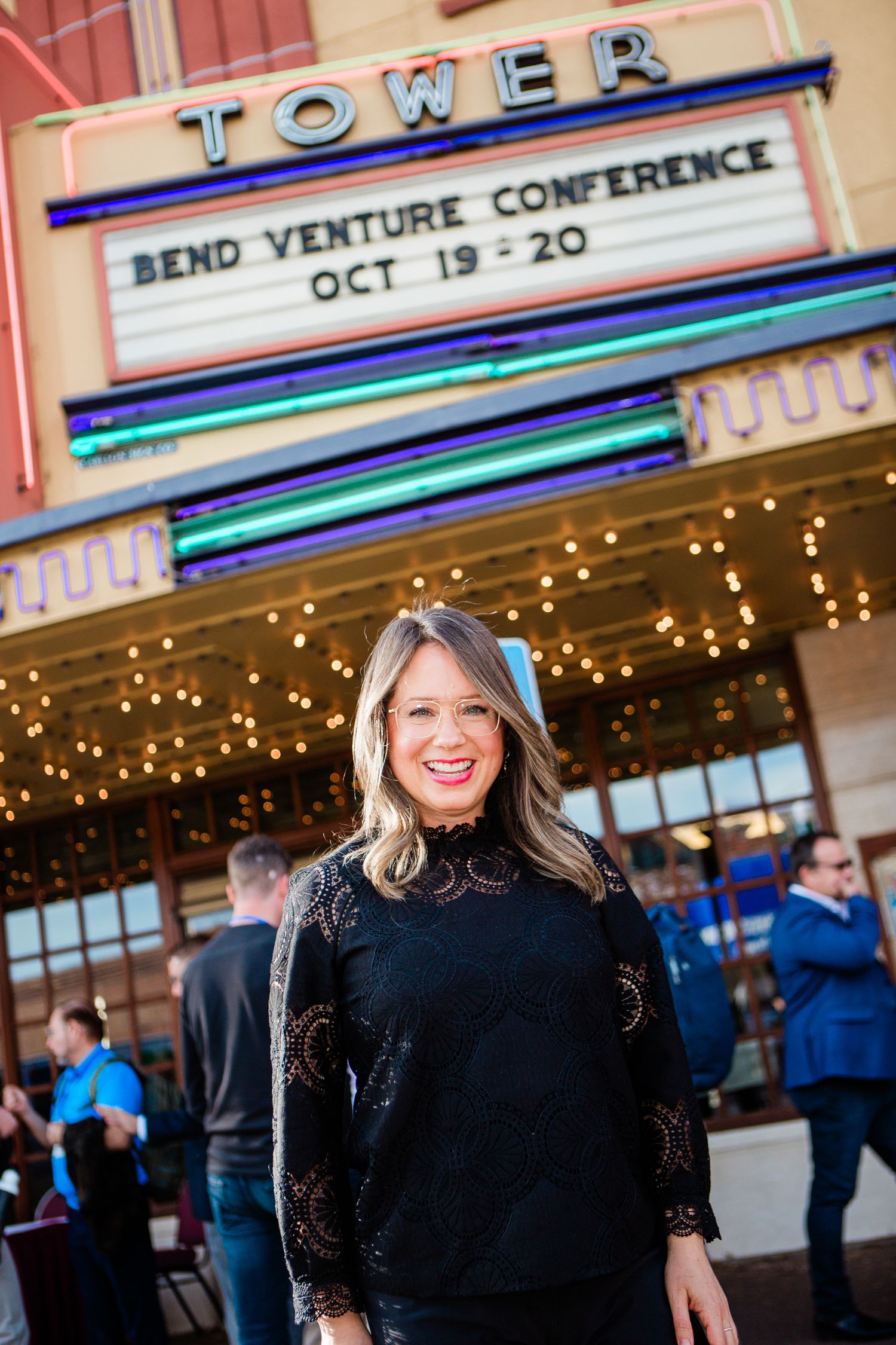 An event emcee in front of the Tower Theater in Bend, Oregon
