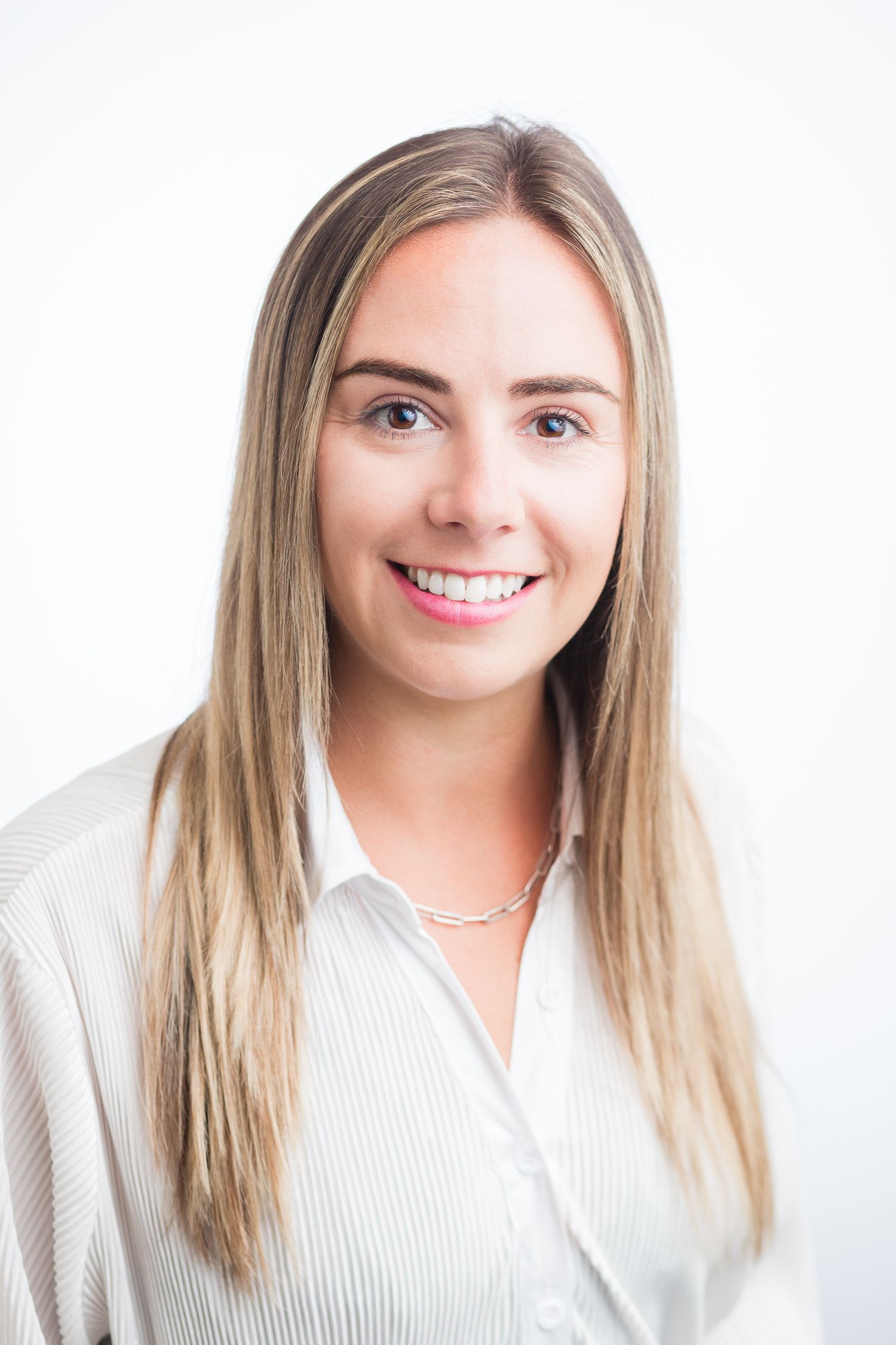 Headshot of a woman in a studio setting